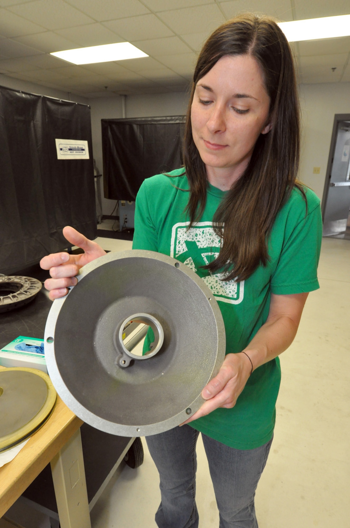 Kathy Morrison, 442nd Maintenance Squadron Nondestructive technician, inspects a component from an A-10 Thunderbolt II March 19, 2012. The 442nd MXS NDI shop is responsible for testing aircraft components for defects. It is part of the 442nd Fighter Wing, an A-10 Thunderbolt II Air Force Reserve Reserve unit at Whiteman AFB, Mo.