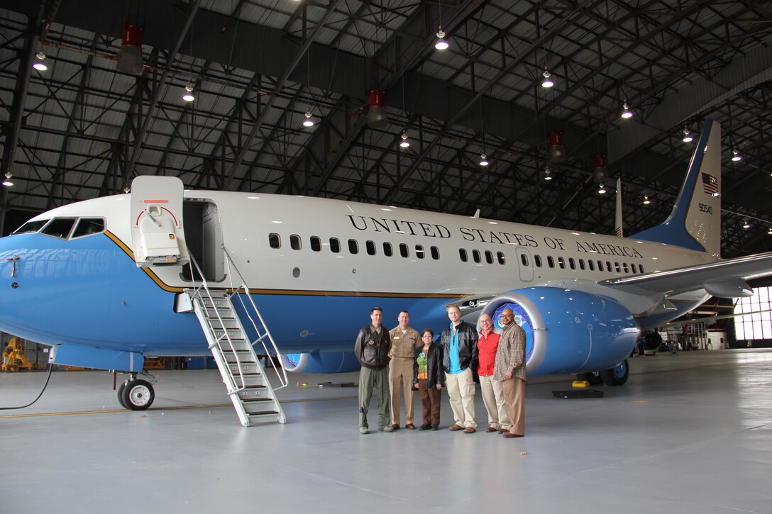 Pilot and interesting speaker, Lt. Col. Ralph DePalma, at far left, gives a tour to members of U.S. Transportation Command to help them better understand the mission and workings of the C-40C airplane belonging to the 932nd Airlift Wing at Scott Air Force Base.  The unit is an Air Force Reserve Command wing near St. Louis.  (U.S. Air Force photo/Maj. Stan Paregien)