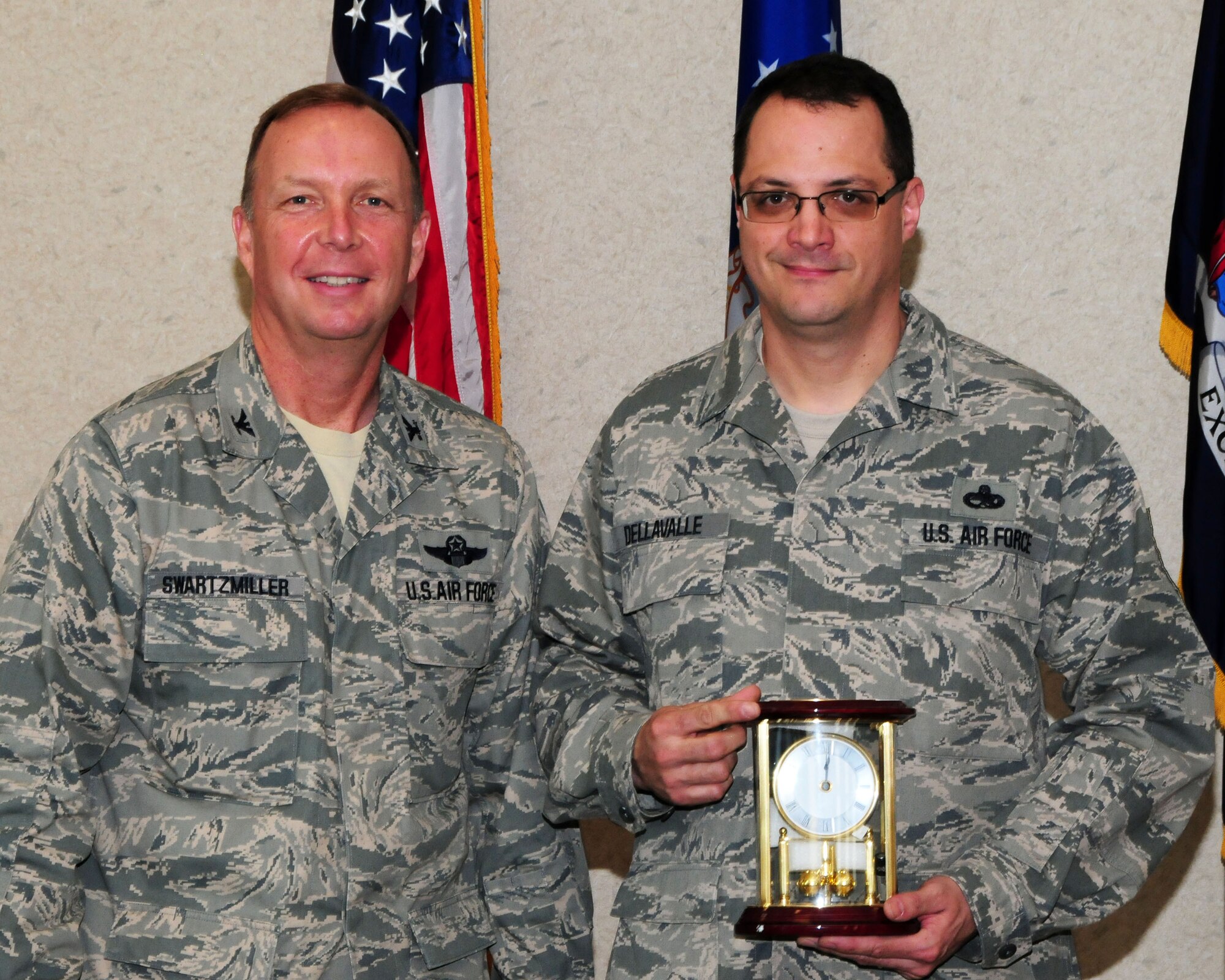 Senior Master Sgt. Joseph Dellavalle, 914th Maintenance Squadron maintenance support flight chief, poses for a photo with Col. Allan Swartzmiller, 914th Airlift Wing commander after receiving the 914th Airlift Wing Annual Civilian Award on March 21, 2012 at the Niagara Falls Air Reserve Station, NY. Dellavalle who is an Air Reserve Technician was one of several recipients who received an award during a civilian commander's call here. (U.S. Air Force photo by Peter Borys)