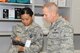 Brigadier Gen. John McMullen, 325th Fighter Wing commander, shadowed Senior Airman Jem Thipphakesone, 325th Medical Support Squadron medical logistics technician, while she performed her daily responsibilities at the 325th MDG. (U.S. Air Force photo by Lisa Norman)