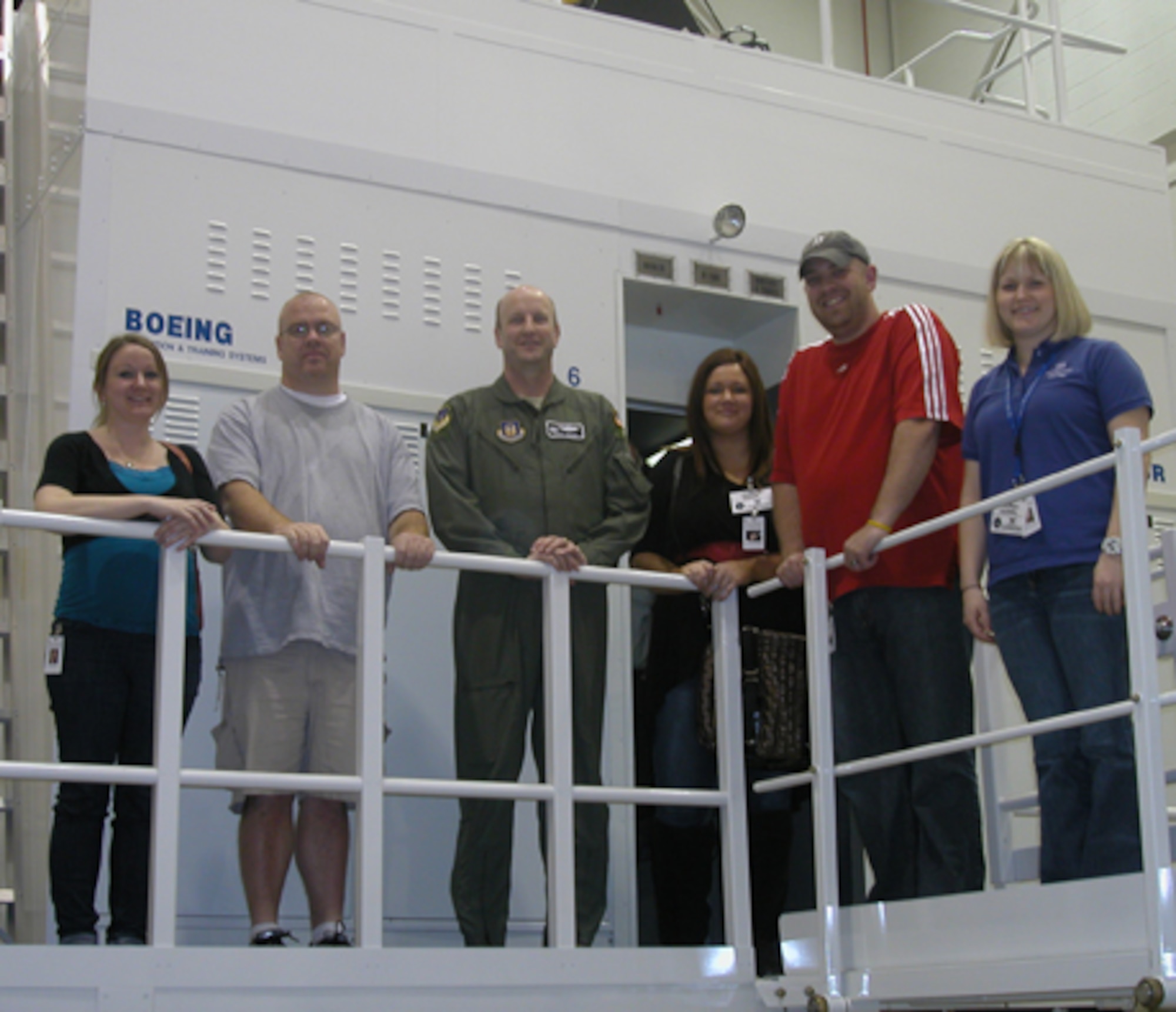 GRISSOM AIR RESERVE BASE, Ind., -- As part of their interactive tour of the 434th Operations Group, Grissom ARB's honorary commanders paid a visit to the KC-135 flight simulator.  Honorary commanders who participated in the tour included (from left) Cassie Dull, Leilan McNally, Jessie Green, Chris Theisen and Andrea Zwiebel.  Colonel Chris Amend (third from left) is the 434th Operations Group commander and was the host for the tour.  (U.S. Air Force photo)        