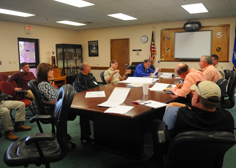 Dyess contractors have a meeting discussing a base project March 20, 2012, at Dyess Air Force Base, Texas.  The contractors work with the 7th Contracting Squadron to complete projects throughout the base. (U.S. Air Force photo by Airman 1st Class Cierra Bullock/ Released)