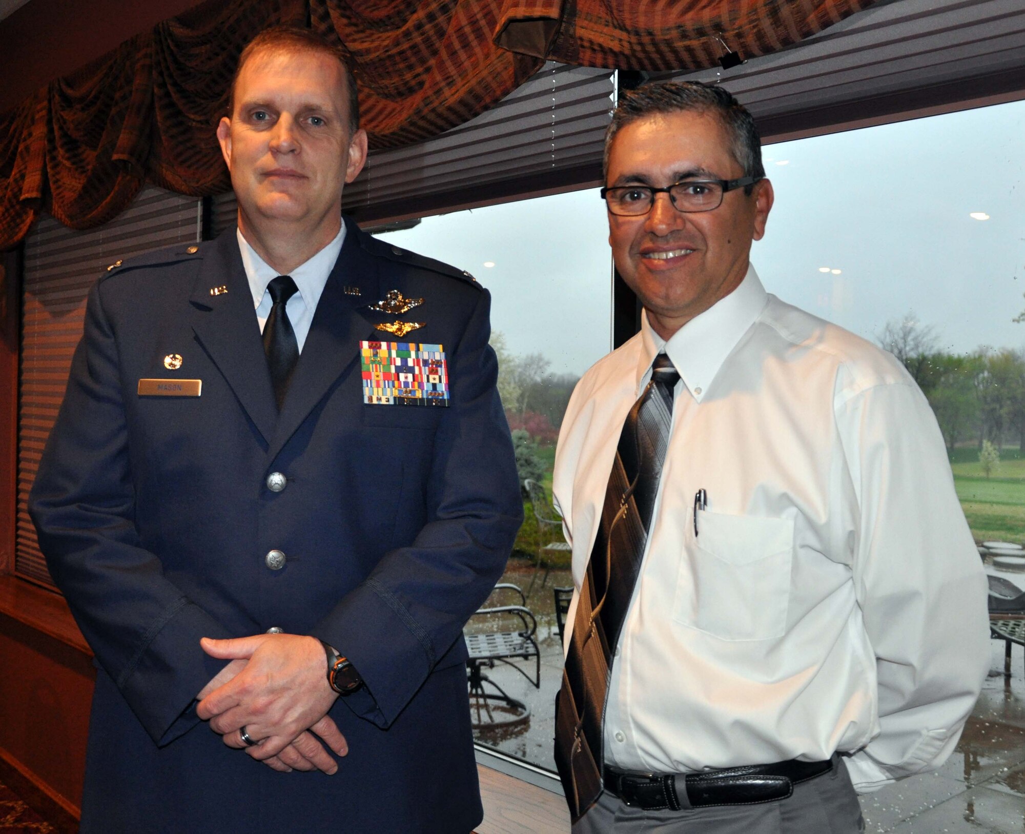 Col. William H. Mason, commander of the 931st Air Refueling Group, McConnell Air Force Base, Kan., visits with Jorge Martinez, the honorary commander of the 931st Air Refueling Group, following a breakfast engagement hosted by the Rotary Club of West Sedgwick County, Wichita, Kan., March 22, 2012.  Mason served as the guest speaker at the event, and presented those in attendance with a unit mission brief outlining the important role played by the 931st and the Air Force Reserve at McConnell Air Force Base.  (U.S. Air Force photo by 1st Lt. Zach Anderson)