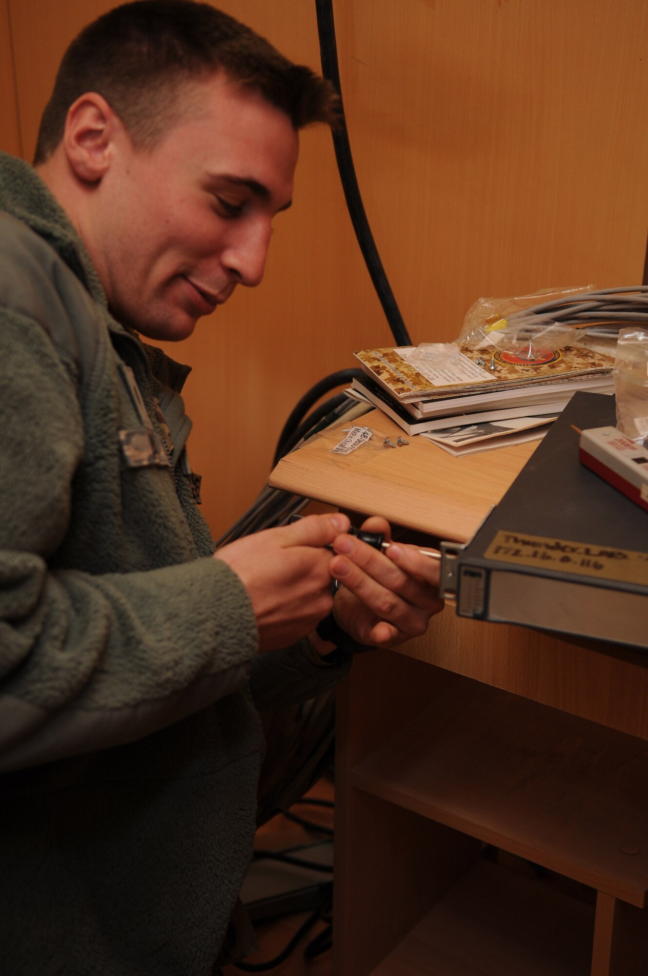 Senior Airman Patrick Wade, a network infrastructure technician with the 445th Air Expeditionary Advisory Squadron, set up a network server for a newly created English language immersion center, Shindand Air Base, Afghanistan, March 20, 2012. Wade is assigned to the 445th AEAS as part of the communications sustainment team that manage all communication capabilities of the 838th Air Expeditionary Group advisors. (U.S. Air Force photo by Staff Sgt. Nadine Y. Barclay)