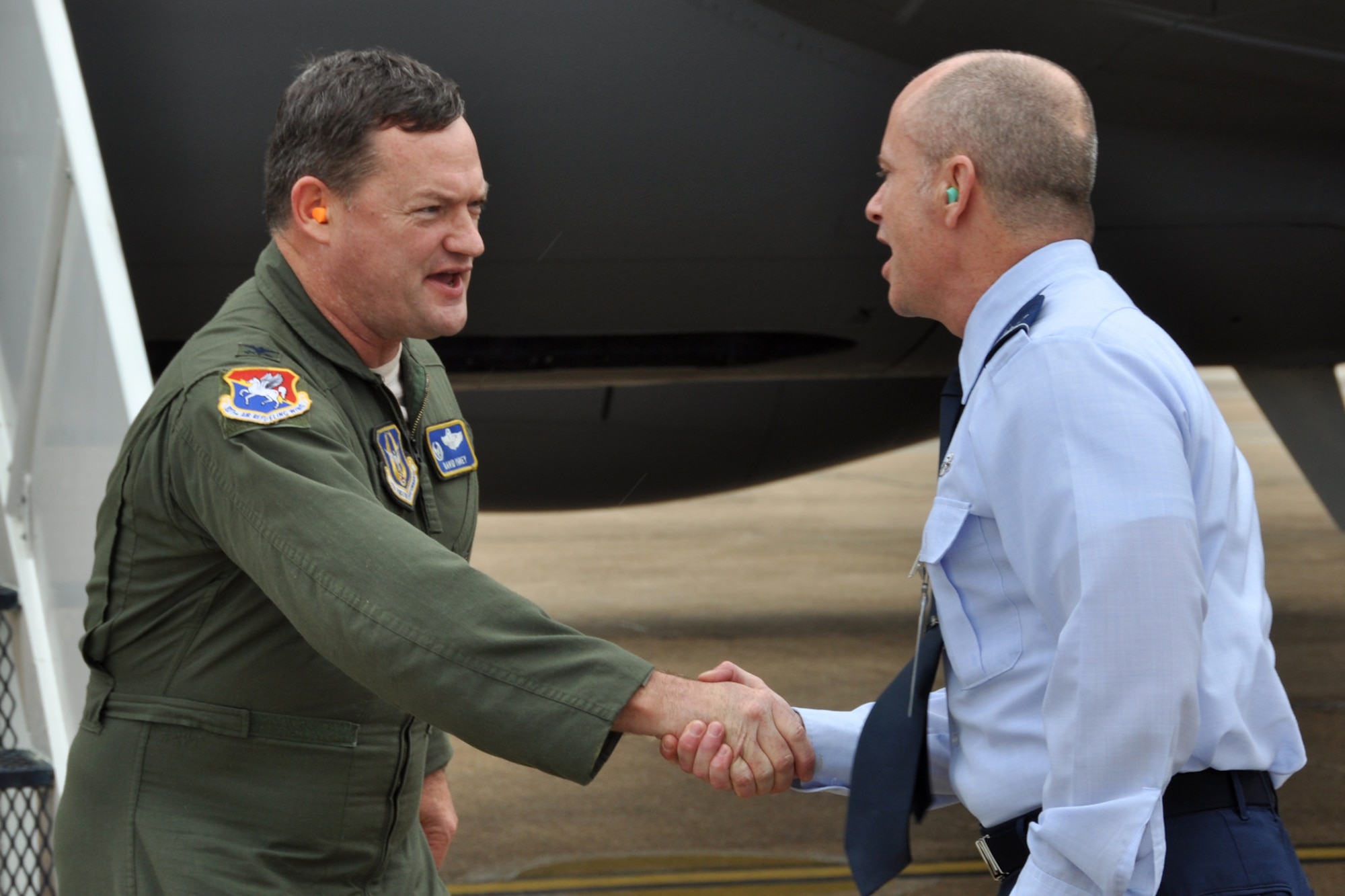 Col. Jonathan Ellis, the commander of the 307th Bomb Wing, welcomes Col. David Pavey, to Barksdale Air Force Base, La., March 19, 2012. Pavey, who is the commander of the 927th Air Refueling Wing, MacDill Air Force Base, Fla., was a military escort for a group of civic leaders from Florida who attended a tour of Barksdale. During their visit they received information on how other units in the Air Force perform their missions. (U.S. Air Force photo by Master Sgt. Jeff Walston/Released)