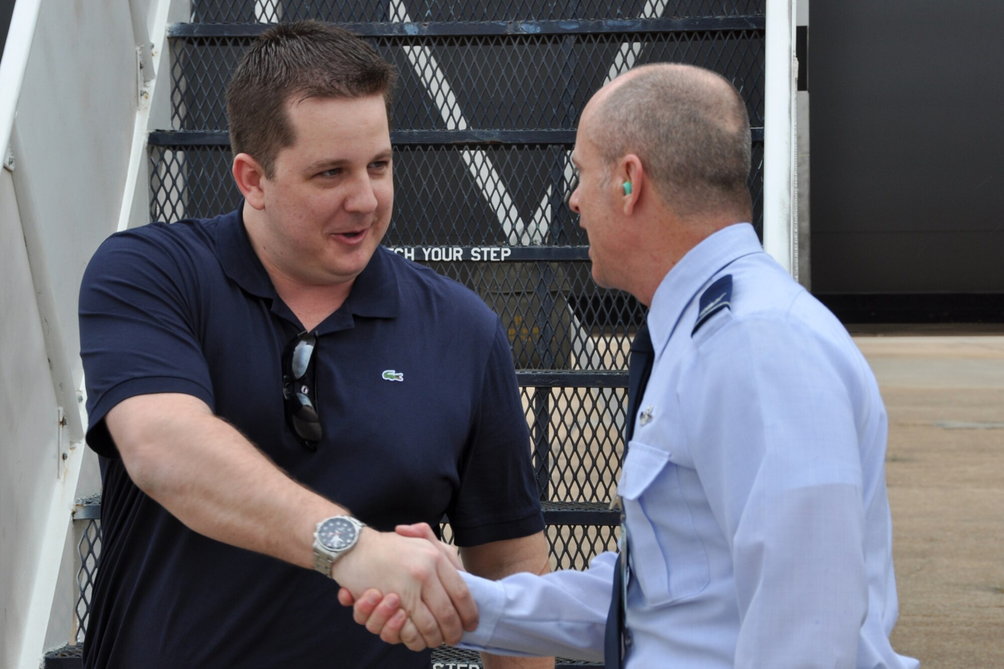 Col. Jonathan Ellis, the commander of the 307th Bomb Wing, welcomes Clinton Mueller to Barksdale Air Force Base, La., March 19, 2012. Mueller, who is the director of development at the Council for Education Change in Weston, Fla., was part of a group of civic leaders from Florida who attended a tour of Barksdale. (U.S. Air Force photo by Master Sgt. Jeff Walston/Released)