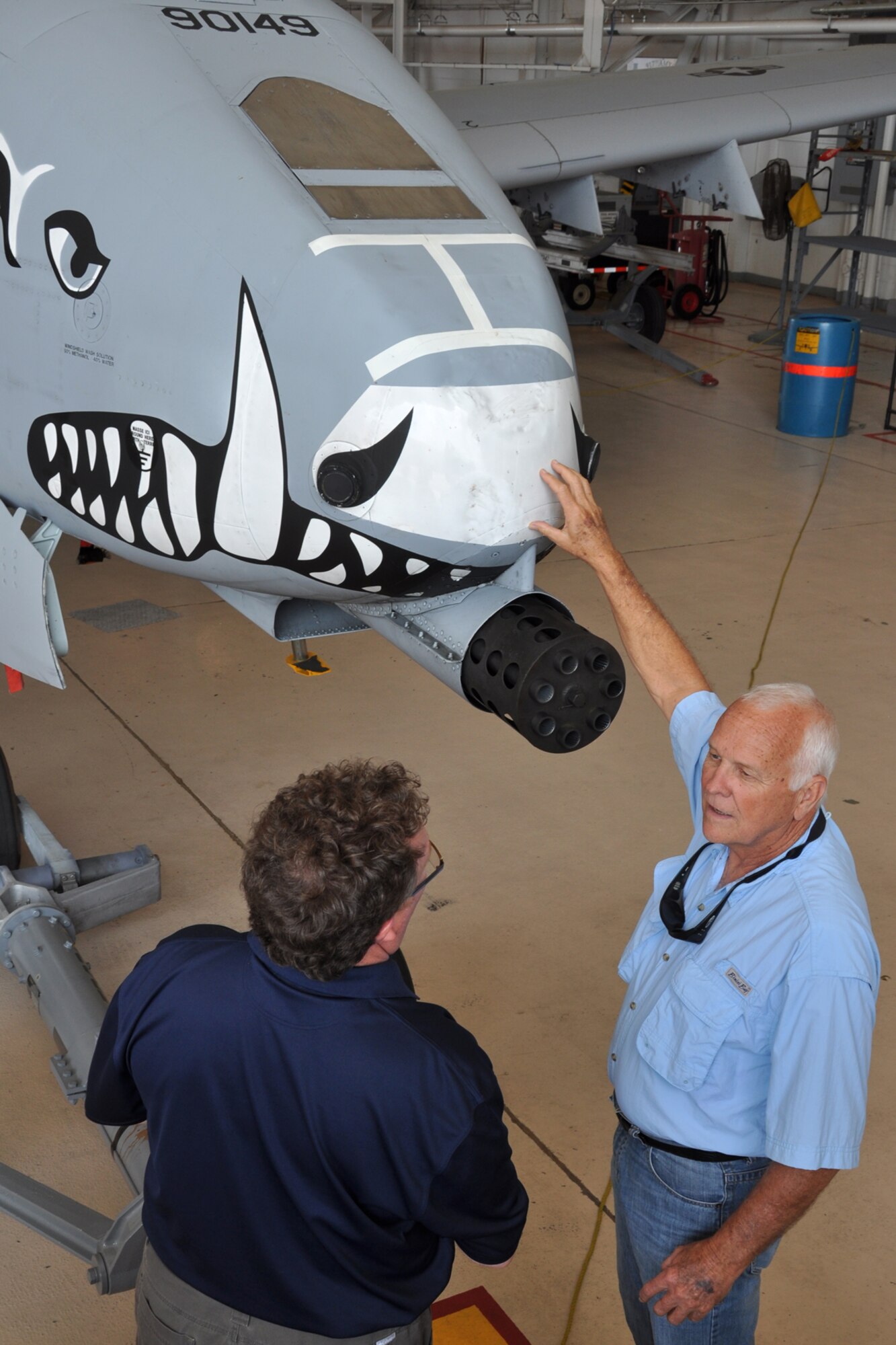Hayward Chapman (right) discusses the A-10 Thunderbolt II with another civic leader during their visit to Barksdale Air Force Base, La., March 19, 2012. The civic leaders were at Barksdale to get a prospective on how other units in the Air Force perform their missions. (U.S. Air Force photo by Master Sgt. Jeff Walston/Released)