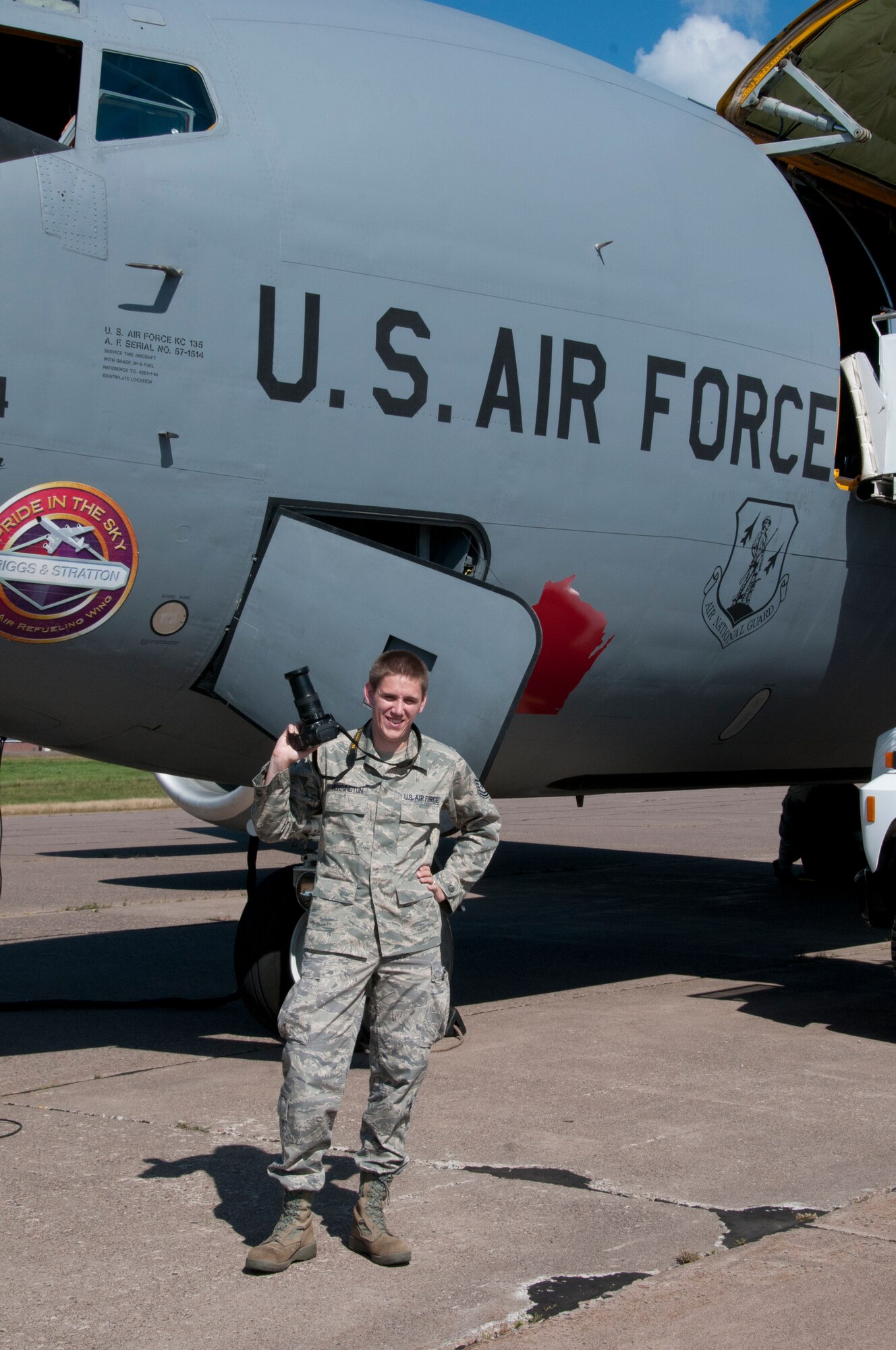 Tech. Sgt. Scott G. Herrington poses in front of a KC-135 after  an orientation flight at the 148th Fighter Wing. Herrington, a journalist at the 148th, has been named the Air National Guard’s “Outstanding New Writer of the Year” for 2011. (National Guard photo by Master Sgt. Ralph j. Kapustka.)