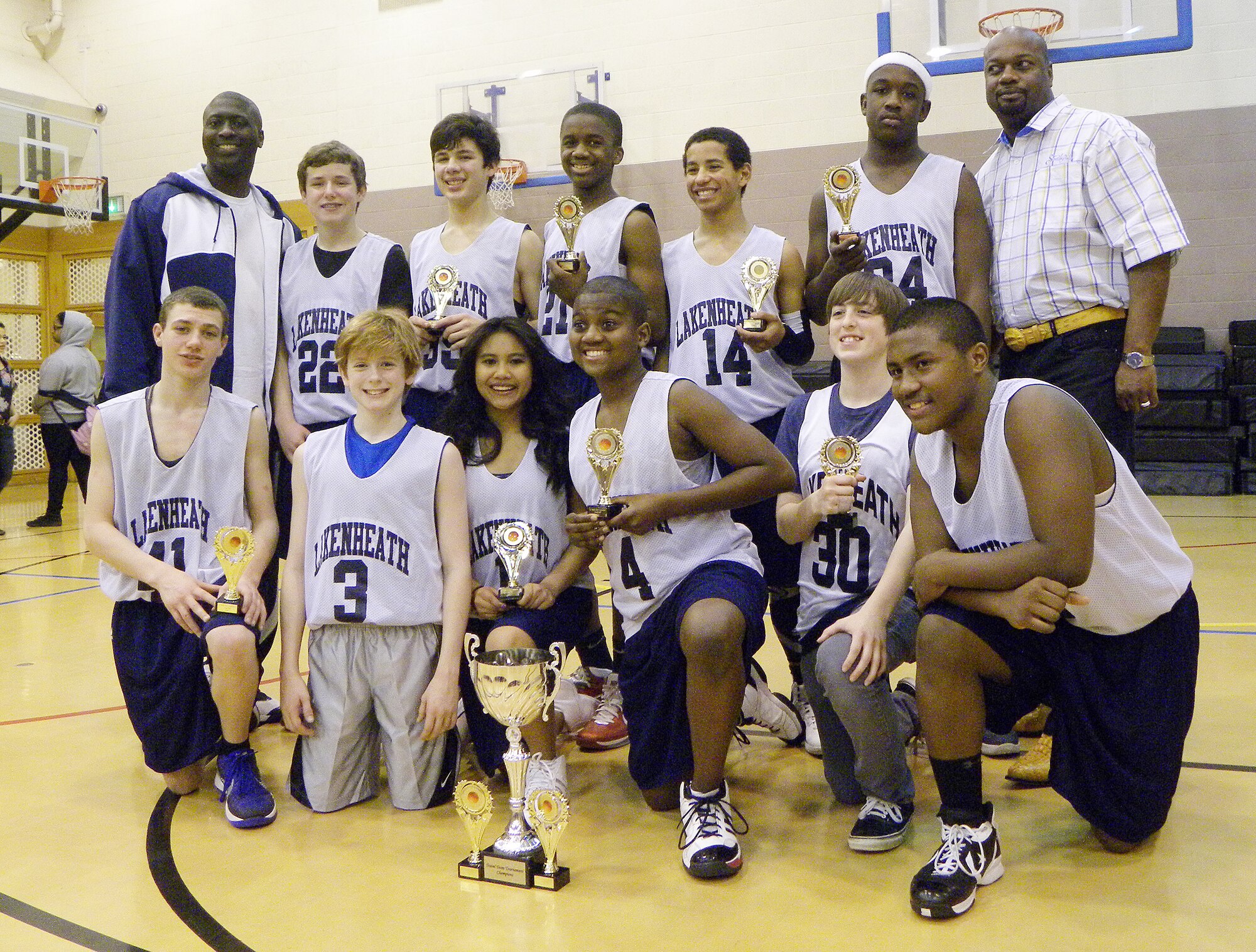 ROYAL AIR FORCE MILDENHALL, England - RAF Lakenheath's 'Dream Team' poses with trophies after defeating the RAF Alconbury team 56-46 at RAF Mildenhall, March 3, 2012. Winning this final game completed their perfect season with a record of 17-0. (Courtesy photo)