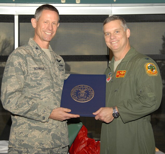 Col. Gregory Schnulo, commander 178th Fighter Wing, presents Col. George Smith, commander 178th Reconnaissance Group with his retirement certificate March 3 at the Springfield Air National Guard Base, Springfield, Ohio.
Smith retires after more than 27 years of service; 13 of which were spent here with the 178 FW.