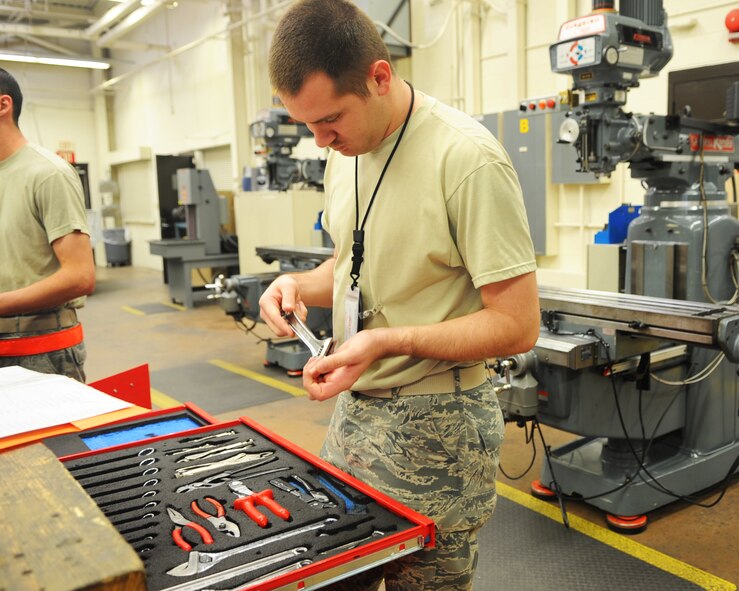 U.S. Air Force 2nd Lt. Shannon Geoghagan, 7th Equipment Maintenance Squadron, performs a consolidated tool kit inspection March 20, 2012, at Dyess Air Force Base, Texas. Geoghagan performs random inspections to make sure Airmen are always mission ready.  (U.S. Air Force photo by Airman 1st Class Cierra Bullock/ Released)
