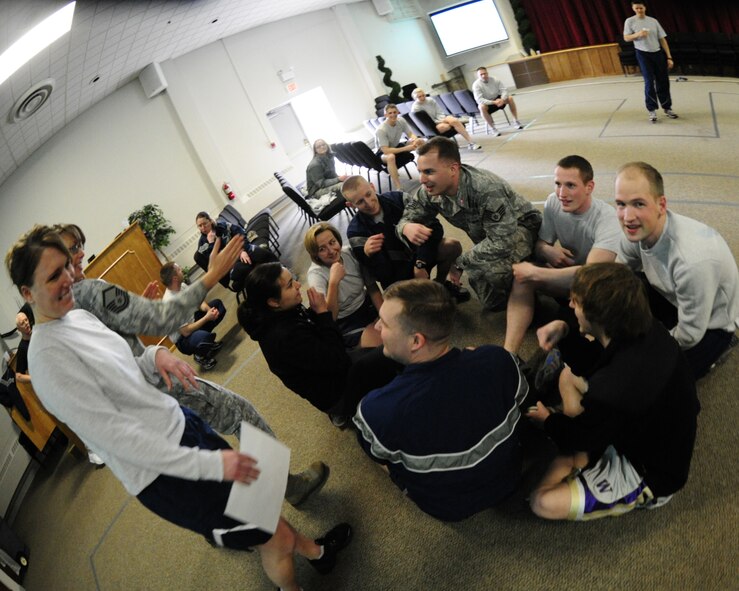 Members of the 62nd Airlift Wing Staff participate in a team building activity as part of training day March 21, 2012, at Joint Base Lewis-McChord, Wash. The activities took place after each wing staff agency conducted training in their own sections. (U.S. Air Force photo/Staff Sgt. Frances Kriss)