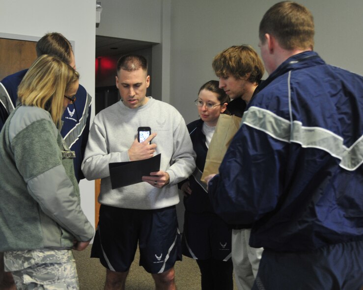 Members of the 62nd Airlift Wing Staff review the rules prior to participating in a team building activity as part of training day March 21, 2012, at Joint Base Lewis-McChord, Wash. (U.S. Air Force photo/Staff Sgt. Frances Kriss)