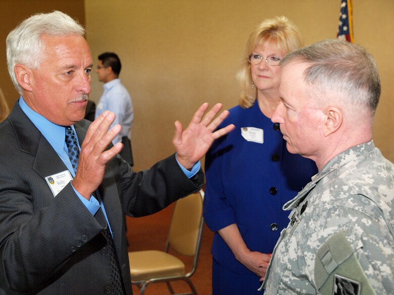 Kelly Stater (left) speaks with Maj. Gen Bo Temple after the general's keynote address to the joint breakfast meeting of Society of American Military Engineers posts from Los Angeles, Orange County and the Inland Empire.