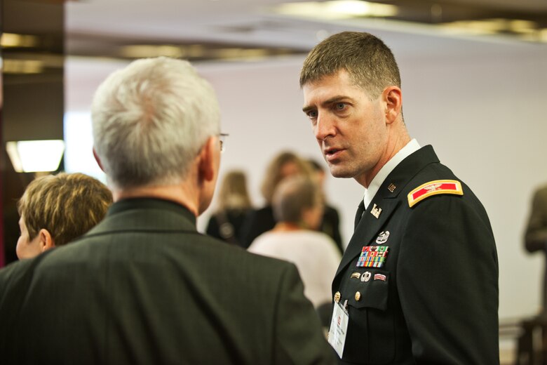 BAD DURKHEIM, Germany - During a break, Col. D. Peter Helmlinger (right), U.S. Army Corps of Engineers Europe District commander, speaks with Holger Basten, Landesbetrieb Liegenschafts und Baubetreuung CEO, at the German-American partnering conference here, Feb. 22-23.