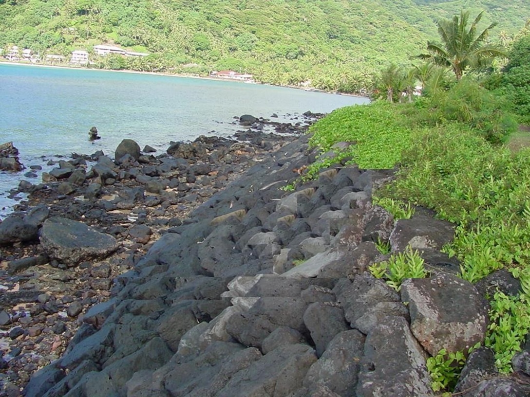 Overview of revetment located at Matafao Shore Protection project, American Samoa. The 460-foot-long rock revetment with a crest elevation of 9.5 feet above mean sea level. The revetment protects and fronts the shoreline at Matafao School. 