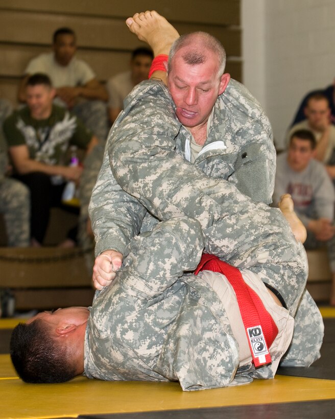 Army Sgt. 1st Class Jeffrey Cesaitis fights for position over Staff Sgt. Kenneth Jackson during the Fifth Annual National Guard Combatives Tournament hosted by the Warrior Training Center on Fort Benning, Ga., March 17, 2012. Cesaitis is assigned to the Massachusetts National Guard; Jackson is assigned to the Washington National Guard

Massachusetts National Guard