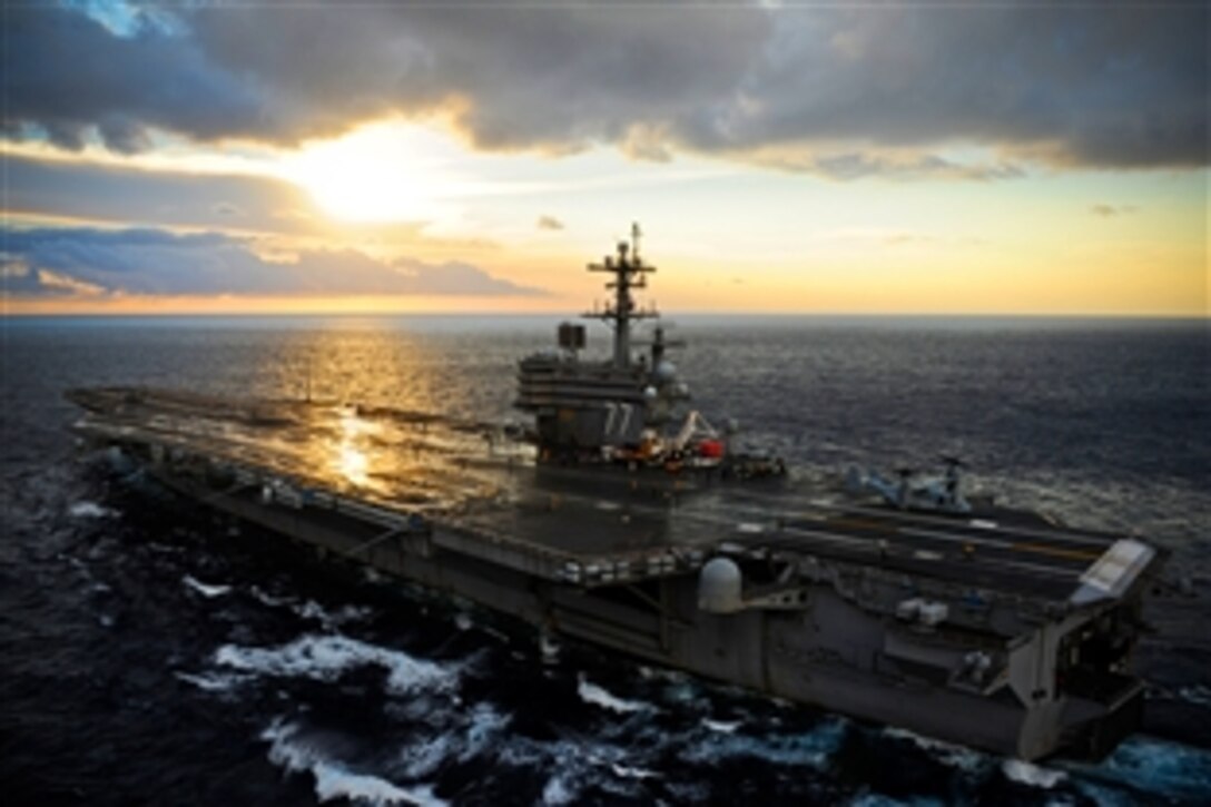 An MV-22 Osprey maneuvers on the flight deck of the aircraft carrier USS George H.W. Bush during test operations in the Atlantic Ocean, March 20, 2012. The George H.W. Bush is in the Atlantic Ocean conducting carrier qualifications.