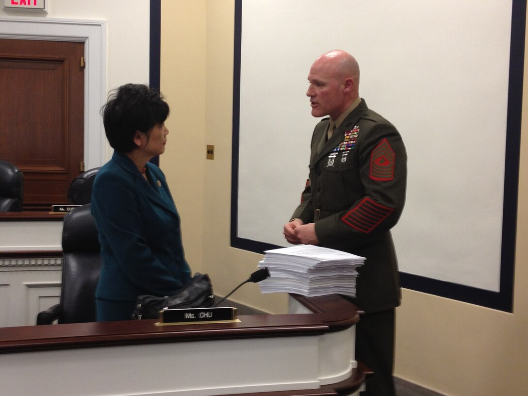 Sgt. Maj. Micheal P. Barrett, the 17th Sergeant Major of the Marine Corps, speaks with Congresswoman Judy Chu following testimony before the House Armed Services Subcommittee on Military Personnel in the U.S. Capitol Complex, Washington D.C., March 22, 2012.