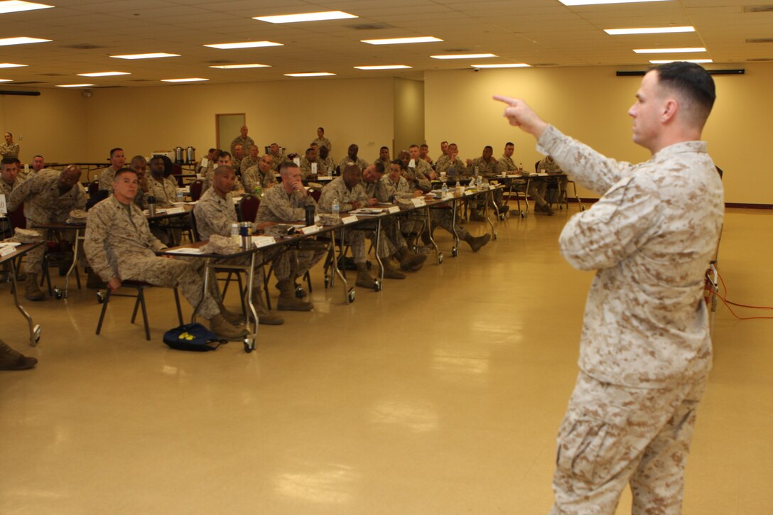 Col. Richard W. Pauly, the 3rd Marine Aircraft Wing comptroller, a military term meaning financial advisor, answers questions concerning budget cuts and money appropriation during a Sergeants Major Symposium aboard Marine Corps Air Station Miramar, Calif., March 21 and 22. Sergeants major, master gunnery sergeants, first sergeants and master sergeants from the West Coast came together to discuss pertinent issues facing the Marine Corps.