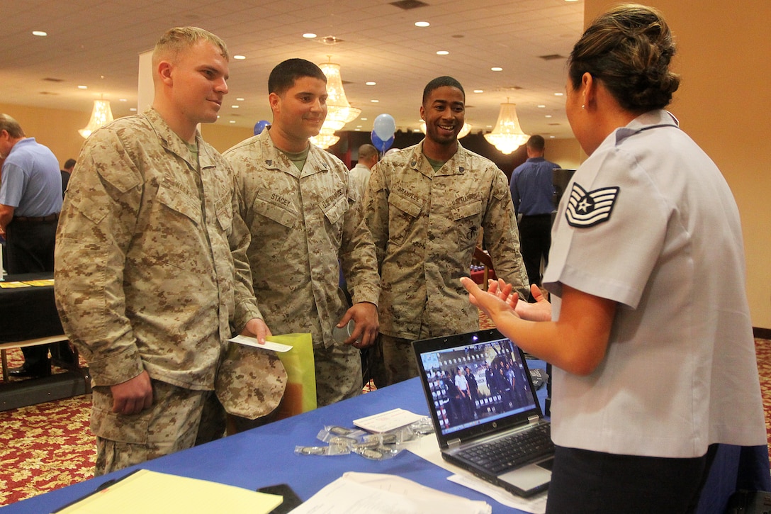 Marines listen intently to an Air Force Reserve recruiter during the annual Spring Career and Education Expo at Camp Pendleton's Pacific Views Event Center, March 22. The expo offered Marines and their family members information about different career opportunities available to them to assist them with an easy transition out of the Corps.