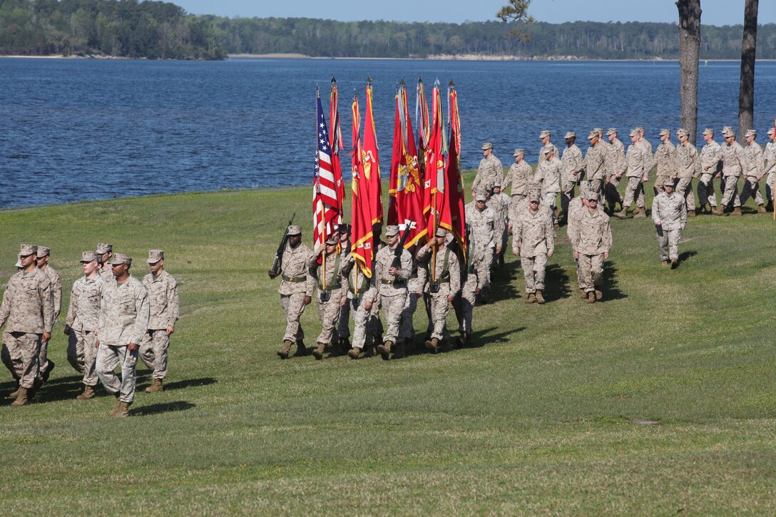 Marines march out to begin the relief and appointment ceremony held aboard Marine Corps Base Camp Lejeune. Sgt. Maj. Robert G. VanOostrom, who served as sergeant major for Marine Corps Installations East from August 2009 to March 2012, handed over the Sword of Office to Sgt. Maj. Ernest K. Hoopii, the new sergeant major for MCIEAST.