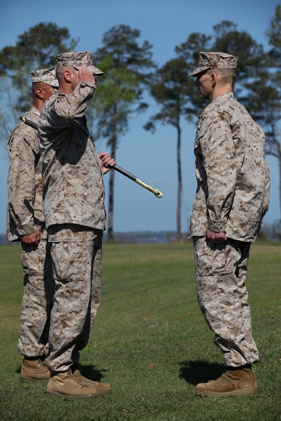 Sgt. Maj. Robert G. VanOostrom, who served as sergeant major for Marine Corps Installations East from August 2009 to March 2012, salutes Brig. Gen. Thomas A. Gorry, commanding general, MCIEAST, prior to handing over the Sword of Office in a relief and appointment ceremony aboard Marine Corps Base Camp Lejeune, March 23.