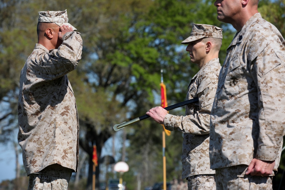 Sgt. Maj. Ernest K. Hoopii, the new sergeant major for Marine Corps Installations East, salutes Brig. Gen. Thomas A. Gorry, commanding general, MCIEAST, prior to receiving the Sword of Office in a relief and appointment ceremony aboard Marine Corps Base Camp Lejeune, March 23.