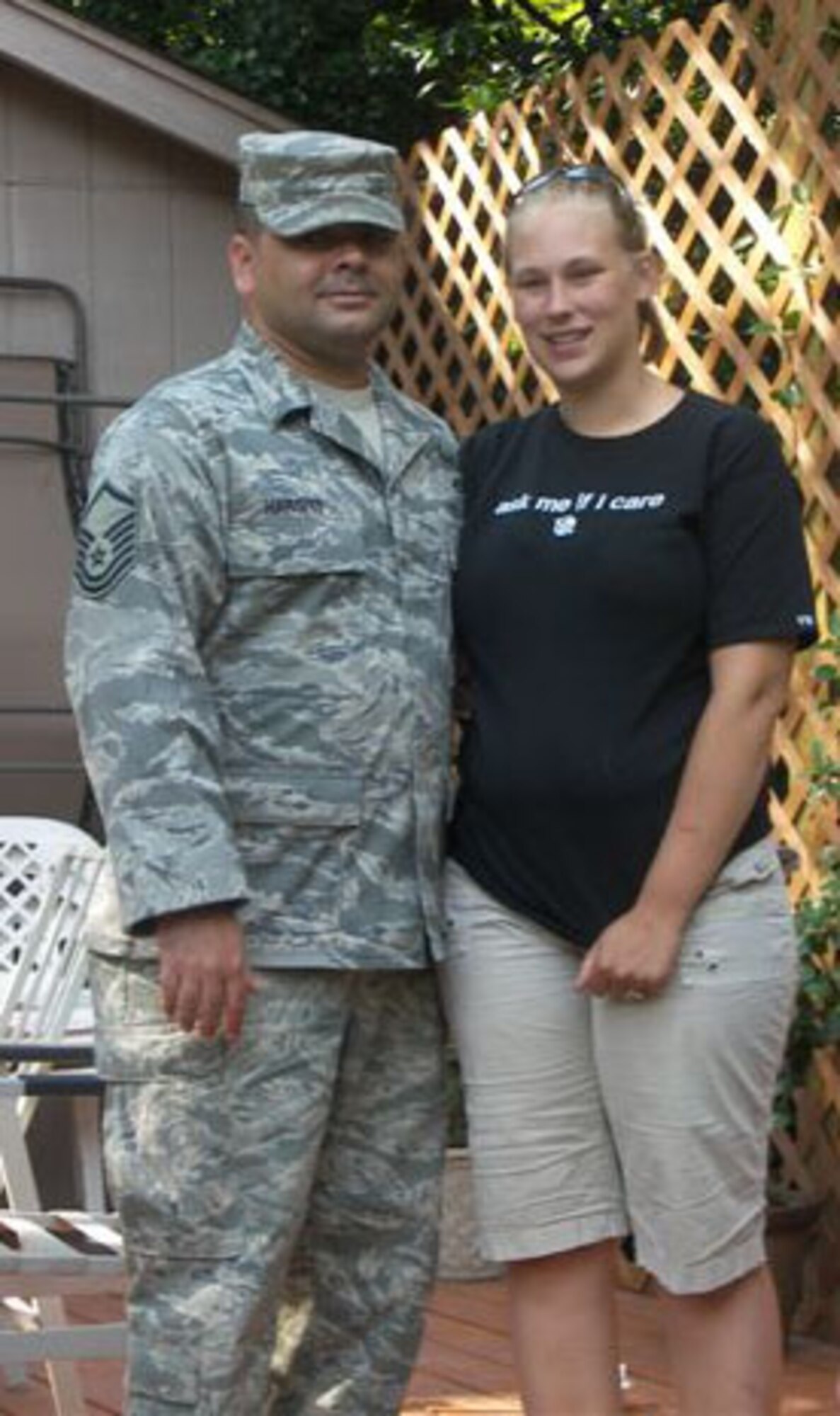 Master Sgt. Travis Hargitt, 446th Civil Engineer Squadron Explosive Ordnance Disposal flight, happily reunites with his wife Aleasha, after returning from a 192 day deployment to Iraq in December 2011.  The Hargitts have two daughters and live in Rainier, Wash. (Courtesy photo)