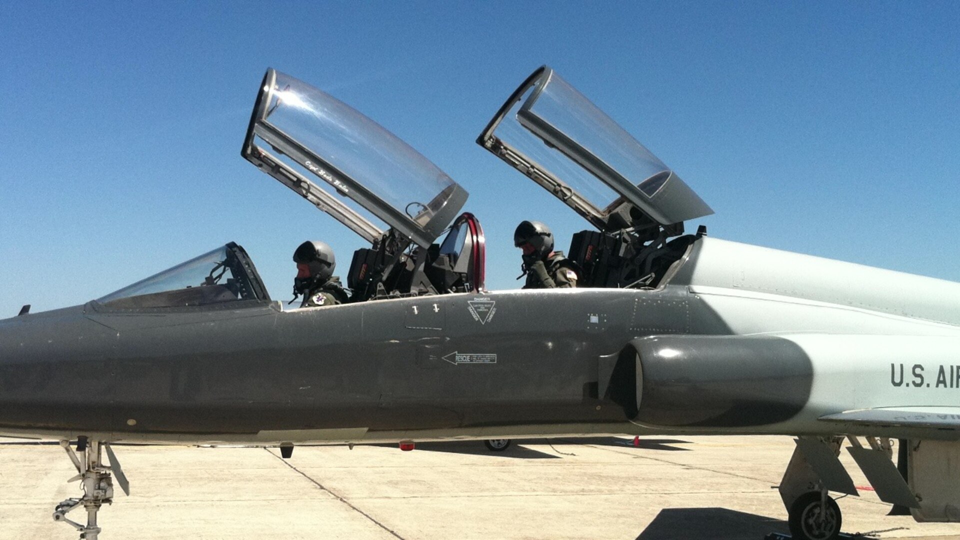 Capt. Jeremy Putman, 560th Flying Training Squadron instructor pilot, and Maj. Gen. Mark Solo, 19th Air Force commander, finish final preparations in their T-38C Talon before departing to take off from Joint Base San Antonio-Randolph, Texas, March 23, 2012.  General Solo flew with the 560th FTS as a part of his evaluation of the T-38 Pilot Instructor Training program during his final visit to the 12th Flying Training Wing before 19th AF inactivates in July.  (Courtesy Photo)