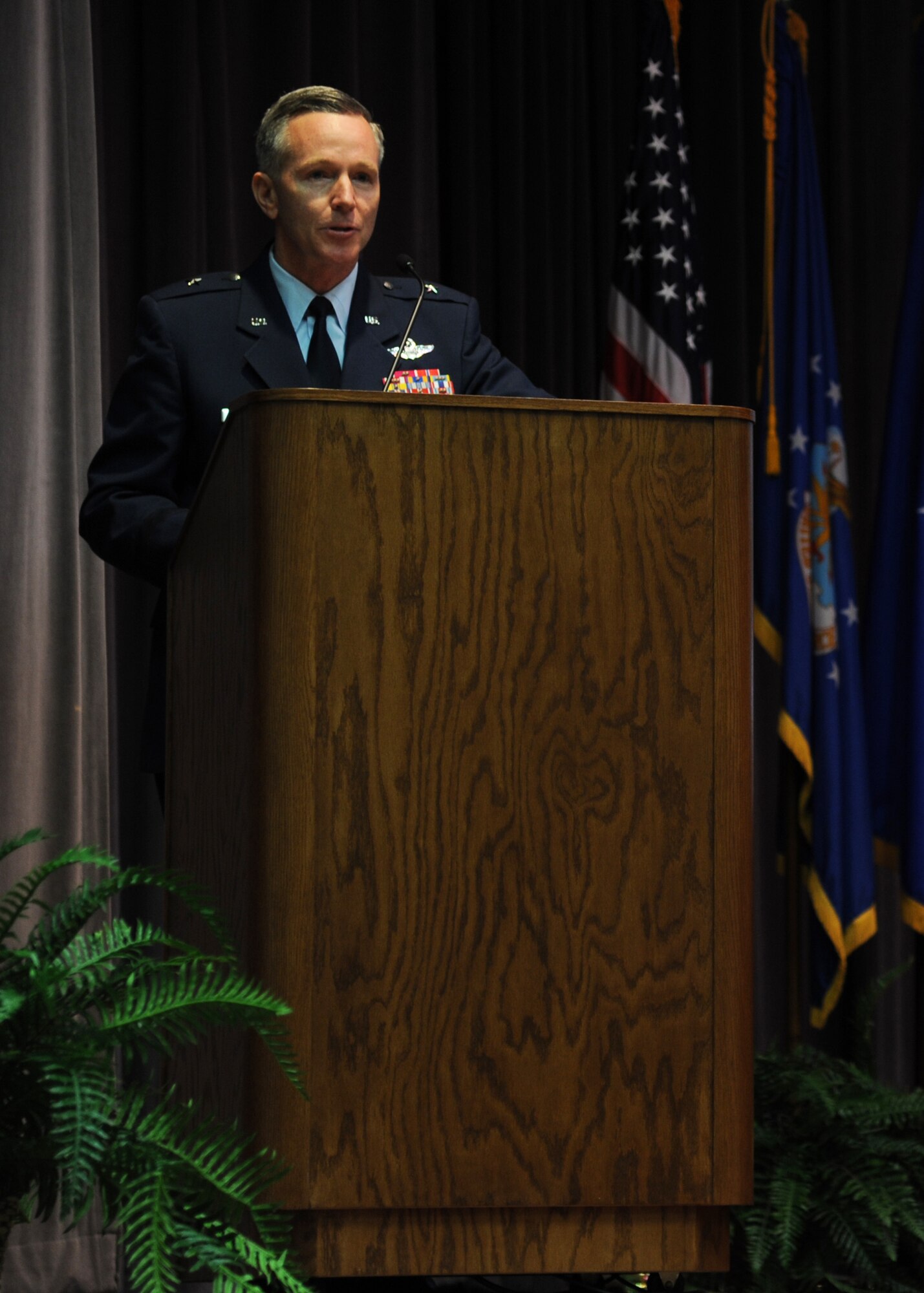 Brig. Gen. William Binger, Commander, 10th Air Force, Naval Air Station Fort Worth Joint Reserve Base speaks during the graduation of Specialized Undergradute Pilot Training Class 12-06 Mar. 16 at Kaye Auditorium.  Binger spoke about how the Reserve contributes to the Air Force Mission and the importance of retaining experience. (U.S. Air Force photo/Airman 1st Class Chase Hedrick)