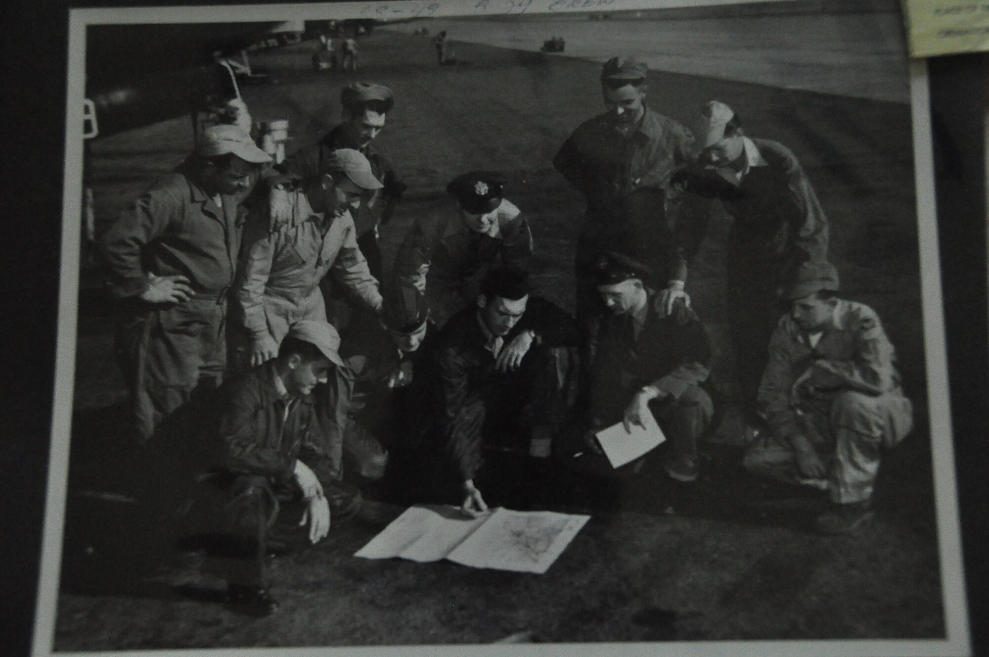 Retired Senior Master Sgt. Steve Palfey, bottom left, looks at a map in 1949 at Fairfield-Suisun Air Base with his fellow B-29 Superfortress crewmembers. (Courtesy photo)