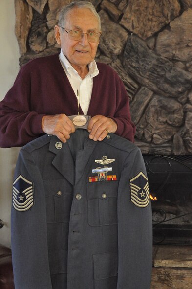 Retired Senior Master Sgt. Steve Palfey shows his '60s-era blues jacket at his home in Fairfield, Calif., on March 5, 2012. The jacket is decorated with the Silver Star he was awarded for his efforts in World War II. The stripes of that era had three stripes below the star, making the stripes displayed in this photo that of a senior master sergeant. (U.S. Air Force photo/Staff Sgt. Timothy Boyer)