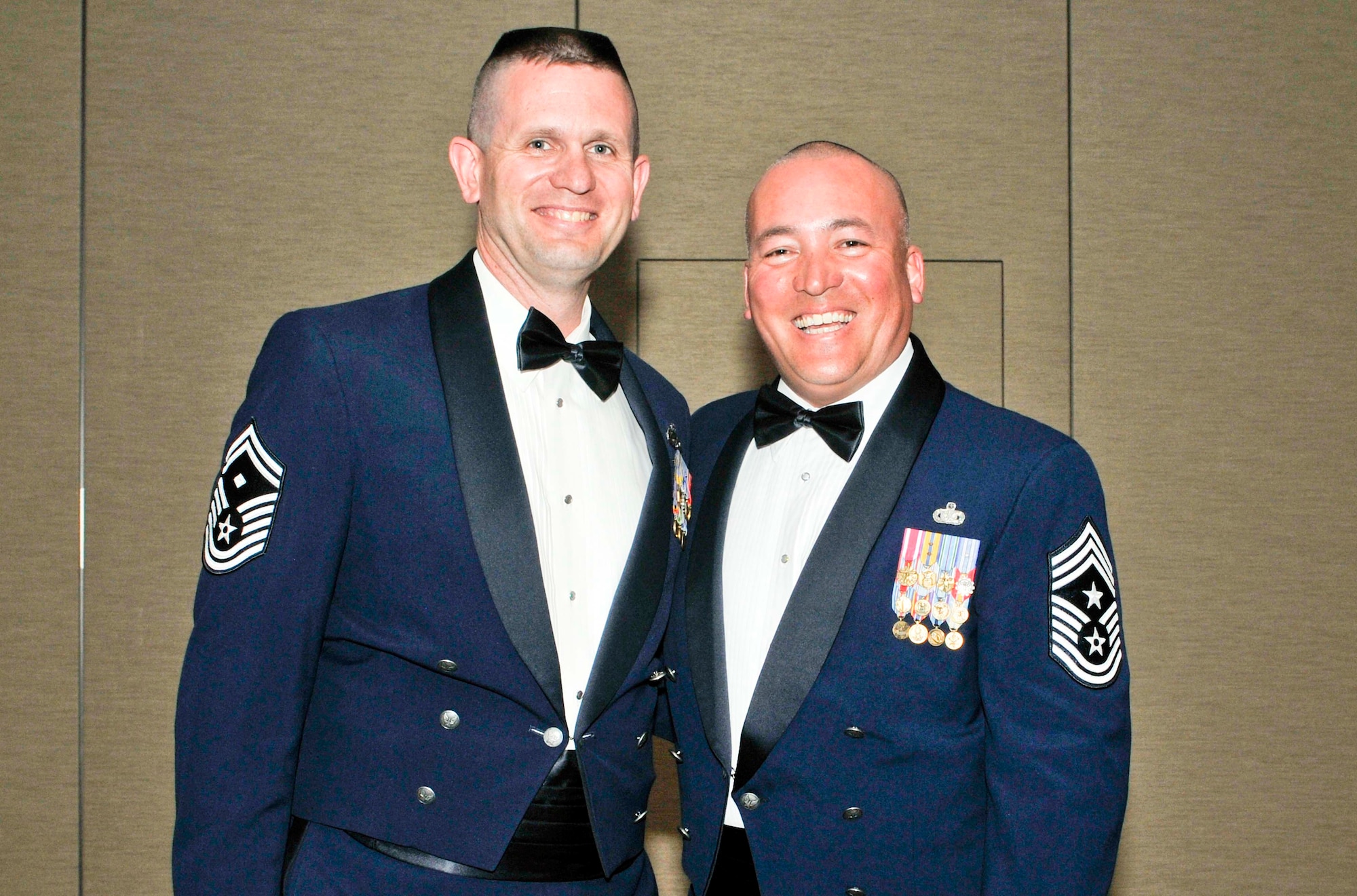 Chief Master Sgt. Mitchell Brush (right), the former Air Forces Northern command chief, and Senior Master Sgt. Thomas Fredrickson, AFNORTH first sergeant, attend the command’s annual award banquet at Tyndall Air Force Base, Fla., March 21. Chief Brush passed responsibility of the command’s enlisted force to Chief Master Sgt. Jim Hotaling during a transfer of authority ceremony at Tyndall March 23. (U.S. Air Force photo by Susan Trahan) 