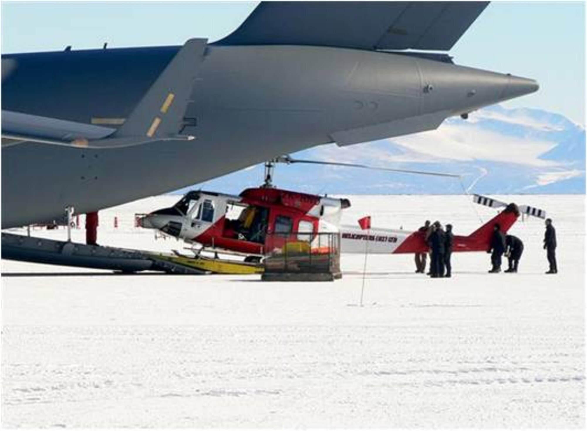 Aircrews from the 62nd and 446th Airlift Wings offload cargo from a C-17 Globemaster III at McMurdo Station, Antarctica. The team recently completed a record-setting Operation Deep Freeze season which consisted of 74 missions, six more than any previous season. The crews also broke the record for amount of cargo delivered by transporting 6.33 million pounds. (U.S. Air Force courtesy photo)