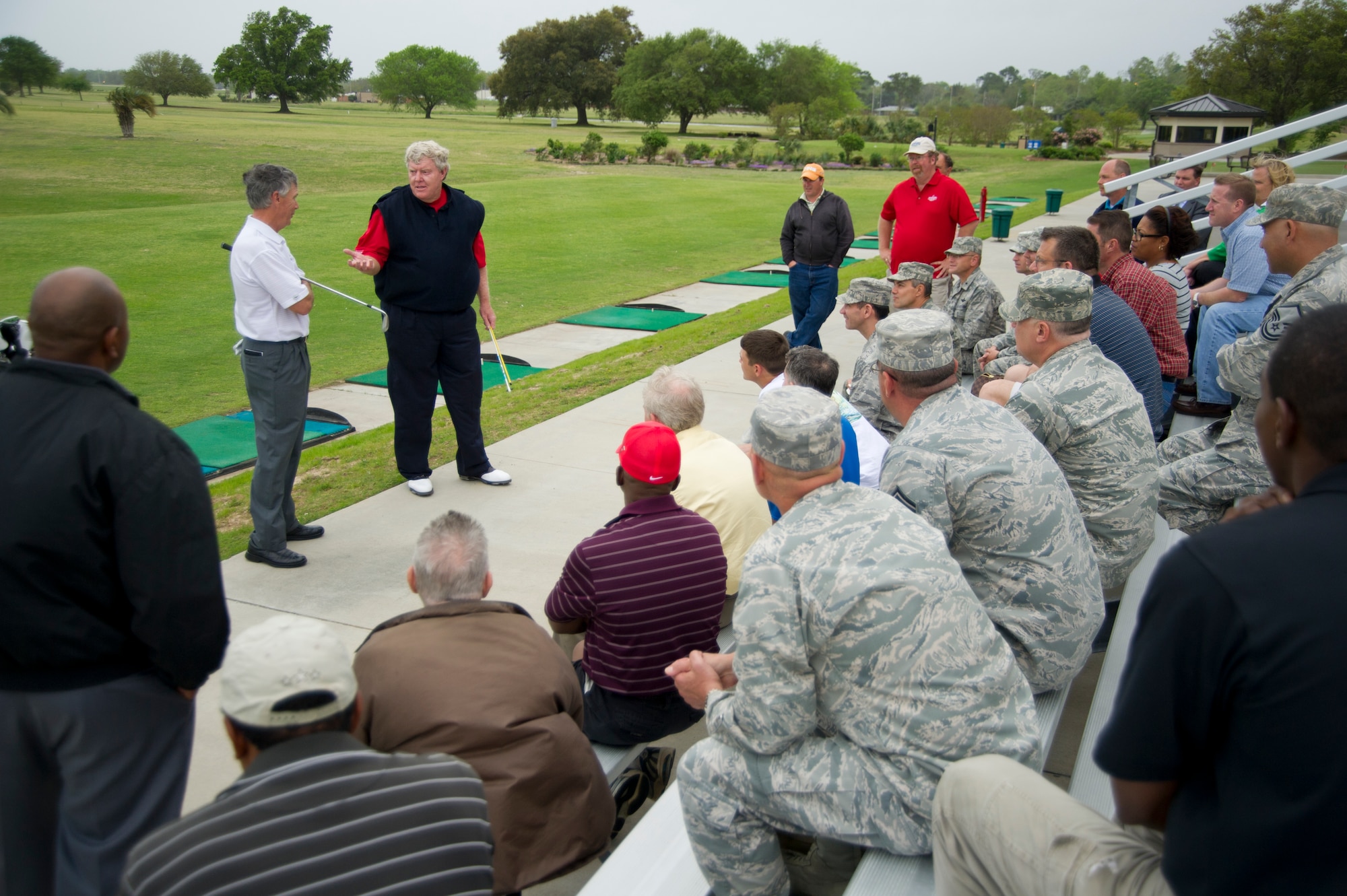 Pro golfers Larry Mize and Andy Bean hold a free golf clinic at the Bay Breeze Event Center March 21, 2012, at Keesler Air Force Base, Miss.  The clinic included a questions and answers session and instructional demonstrations at the driving range.  (U.S. Air Force photo by Adam Bond)