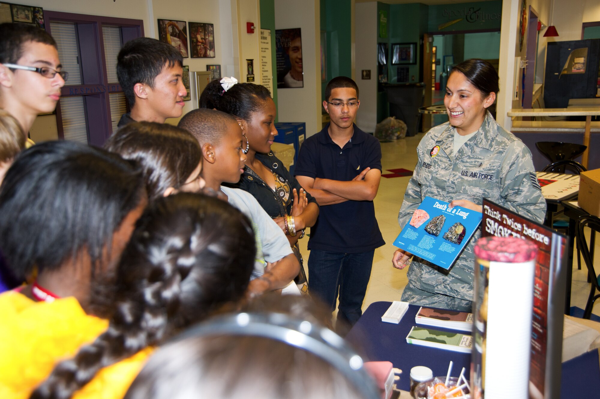 Tech Sgt. Eric Shepherd, 81st Aerospace Medicine Squadron, explains to children at the youth center the damage smoking can have on lung tissue March 21, 2012, at Keesler Air Force Base, Miss.  The exhibit is part of Kick Butts Day, an anti-smoking event.  (U.S. Air Force photo by Adam Bond)