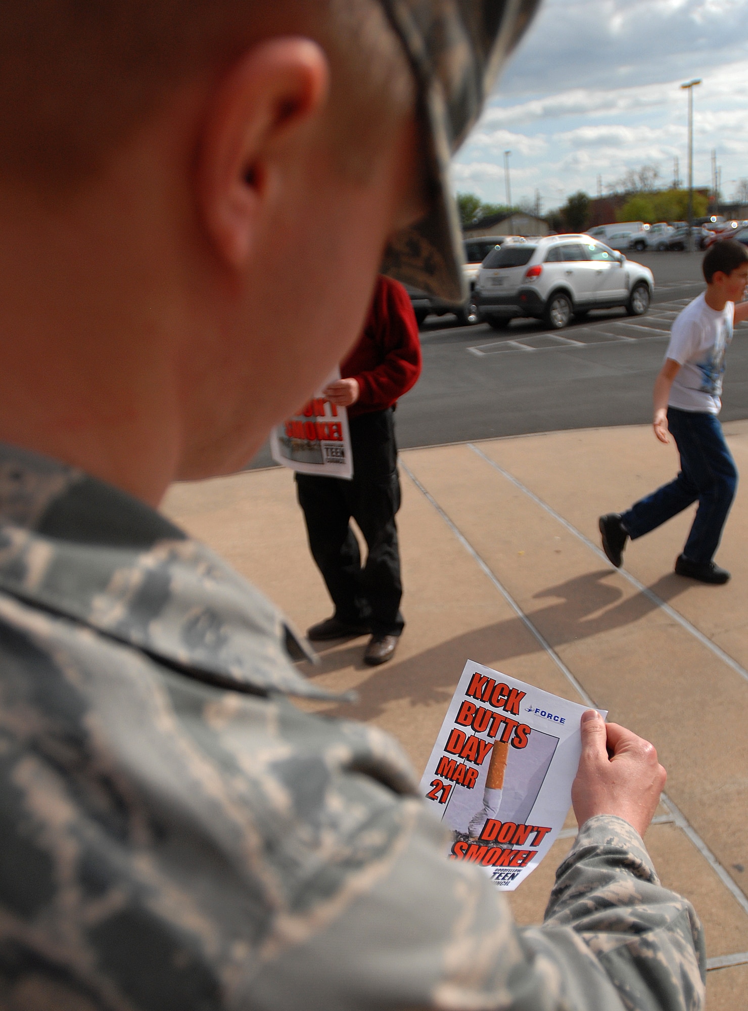 GOODFELLOW AIR FORCE BASE, Texas – Airman 1st Class Patrick Eichamer, 17th Medical Support Squadron, reads a Kick Butts Day flyer March 23, here. Nearly 1,200 organized events across the U.S. participated in the 17th annual kick Butts Day. (U.S. Air Force photo/ Airman 1st Class Michael Smith)