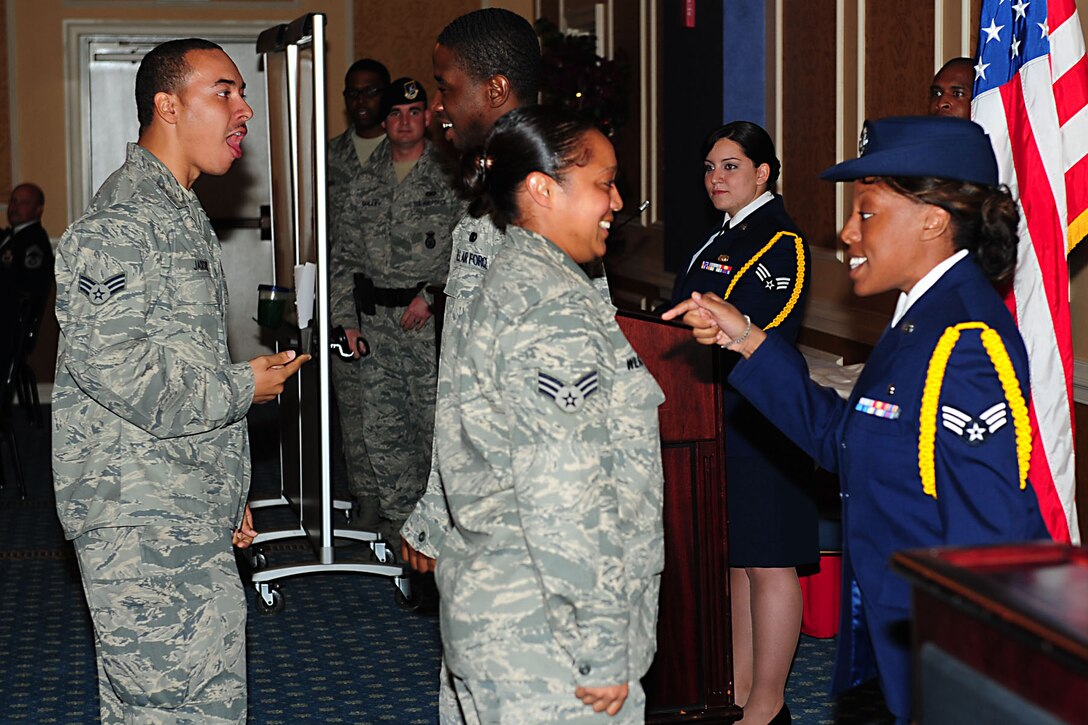 Students from Airman Leadership School class 12-C perform a skit at Langley Air Force Base, Va., March 22, 2012. The performance compared the lives of two Airmen as they progressed through their careers on right and wrong paths.  (U.S. Air Force photo by Airman 1st Class Kayla Newman/Released)