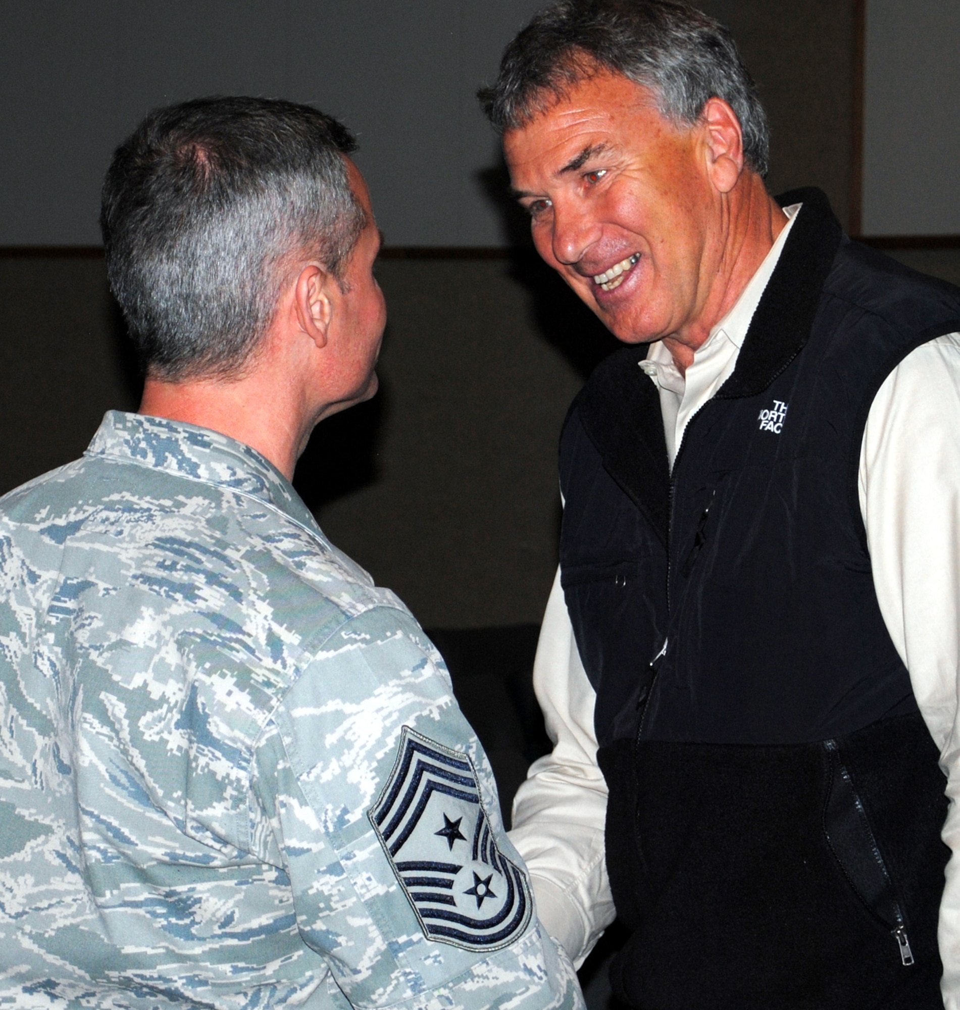 Chief Master Sgt. Charles Anderson, 341st Missile Wing command chief, shakes the hand of Tom Whittaker, the first disabled person to reach the summit of Mount Everest.  Whittaker told his story of pursuing, and eventually achieving, his dreams after losing his right foot due to a car accident he was involved in in his early 30's.  (U.S. Air Force photo/Airman 1st Class Cortney Paxton)