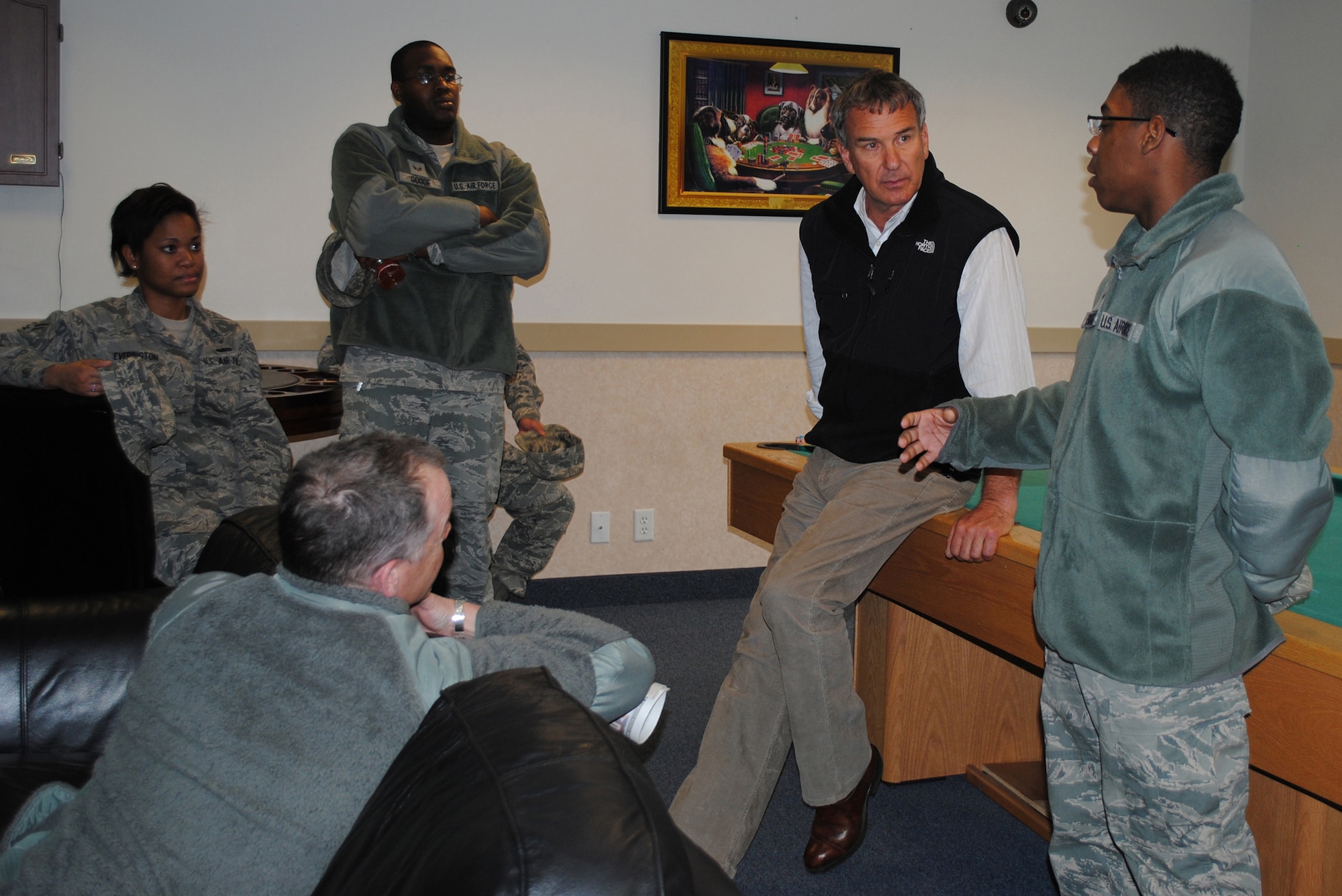 Robi Powers, founder of the American300 Warrior Tours (bottom left), and Tom Whittaker, first disabled person to reach the summit of Mount Everest, listen to Airman 1st Class Lester Brewer, 341st Logistics Readiness Squadron vehicle mechanic (right), discuss life in Malmstrom’s dormitory complex March 21. Airman 1st Class Amanda Everington, 341st Force Support Squadron food service apprentice, and Senior Airman Andrae Goode, 341st Communications Squadron visual imagery intrusion detection systems technician, standby to help answer questions.  (U.S. Air Force photo/Airman 1st Class Katrina Heikkinen)