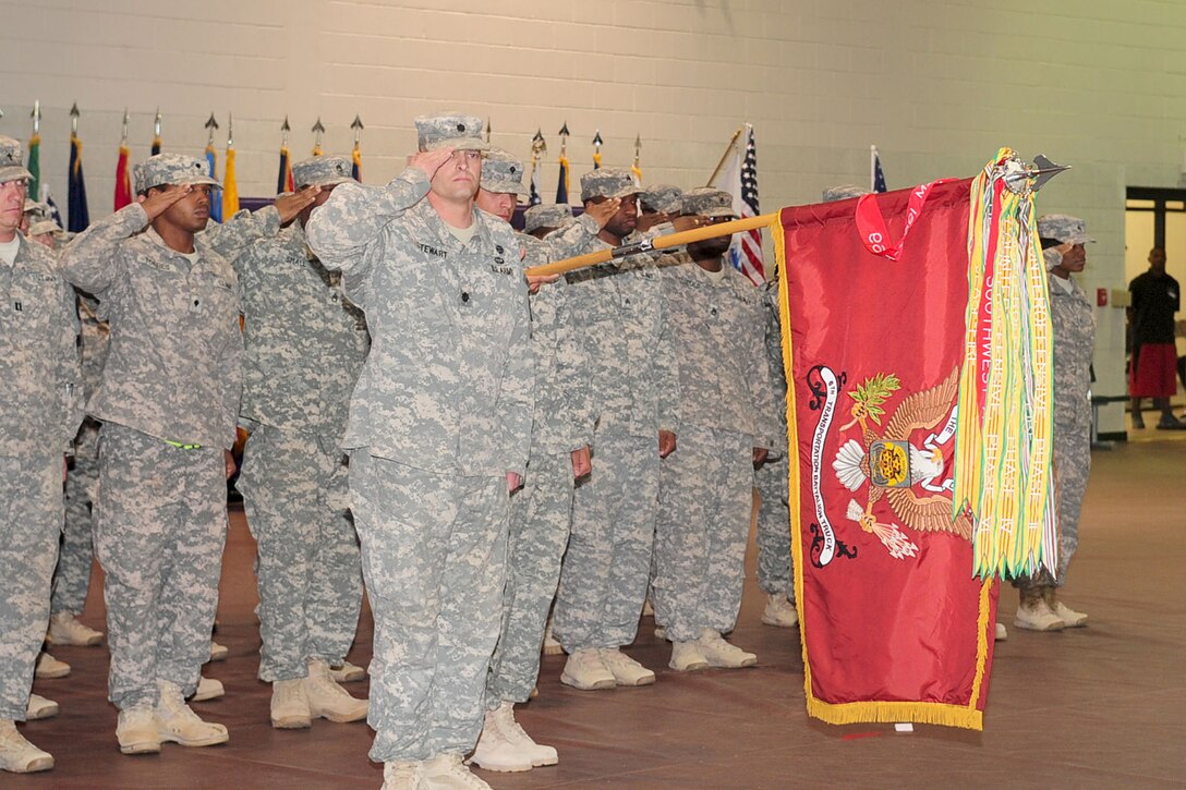 Members of the 7th Sustainment Brigade, 6th Battalion, Headquarters and Headquarters Company salute as the National Anthem plays during their homecoming ceremony at the McClellan Fitness Center, Fort Eustis Va., March 22, 2012. The unit finally made it home to their families after a year-long deployment. (U.S. Air Force photo by Staff Sgt. Ashley Hawkins/Released)