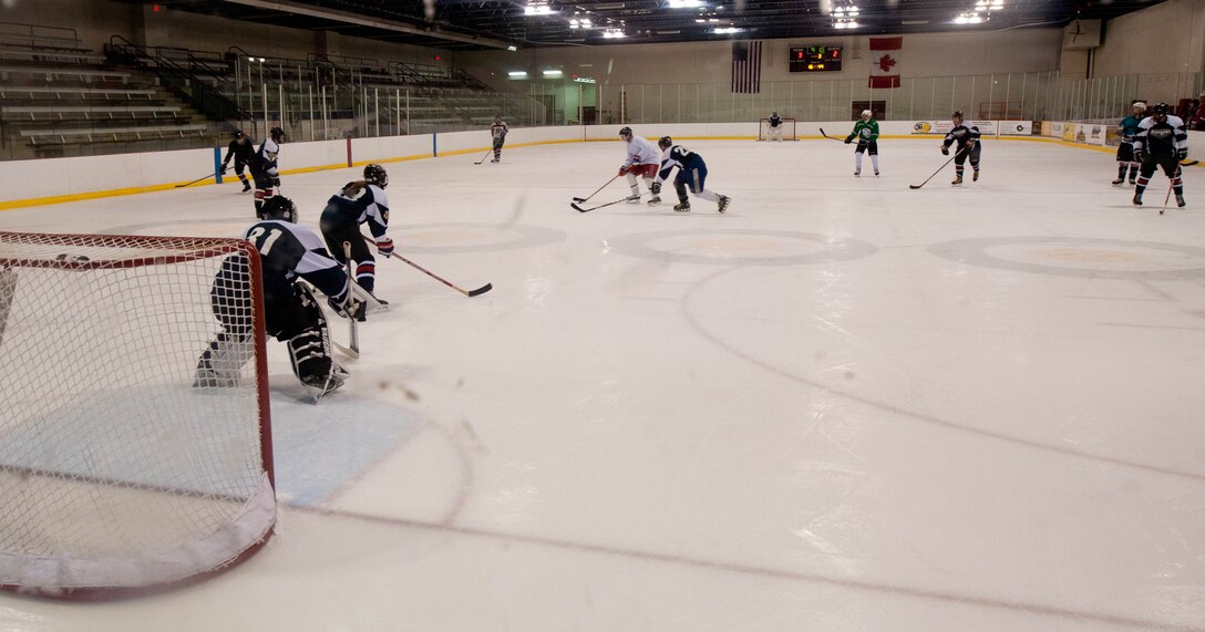 The Ellsworth Bombers Hockey team members practice against each other at the Roosevelt Ice Park Arena in Rapid City, S.D., March 19, 2012. The Ellsworth Bombers include more than 27 Airmen from the base, from a variety of career fields and with varying levels of skill. (U.S. Air Force photo by Airman 1st Class Zachary Hada/Released)