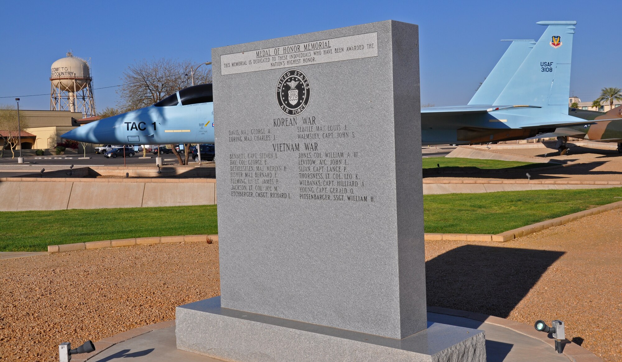 A monument at the Luke Air Force Base Air Park lists the names of Airmen who have been awarded the Medal of Honor.  Among them is retired Col. James Fleming, who received the award for heroism as a helicopter pilot in the Vietnam War.  Fleming visited Luke AFB on March 16 to give a presentation at the 308th Fighter Squadron, recounting his experiences in the war.  (U.S. Air Force photo by Capt. Tristan Hinderliter)