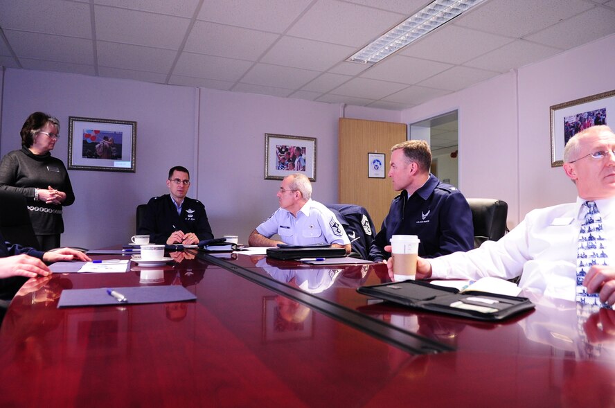 Brig. Gen. C.K. Hyde, 86th Airlift Wing commander, and Command Chief Master Sgt. James Morris are briefed while visiting the Airmen and Family Readiness Center on Ramstein Air Base, Germany, March 19, 2012. The AFRC supports families by providing exceptional quality of life for the entire KMC. (U.S. Air Force photo by Senior Airman Brittany Perry)