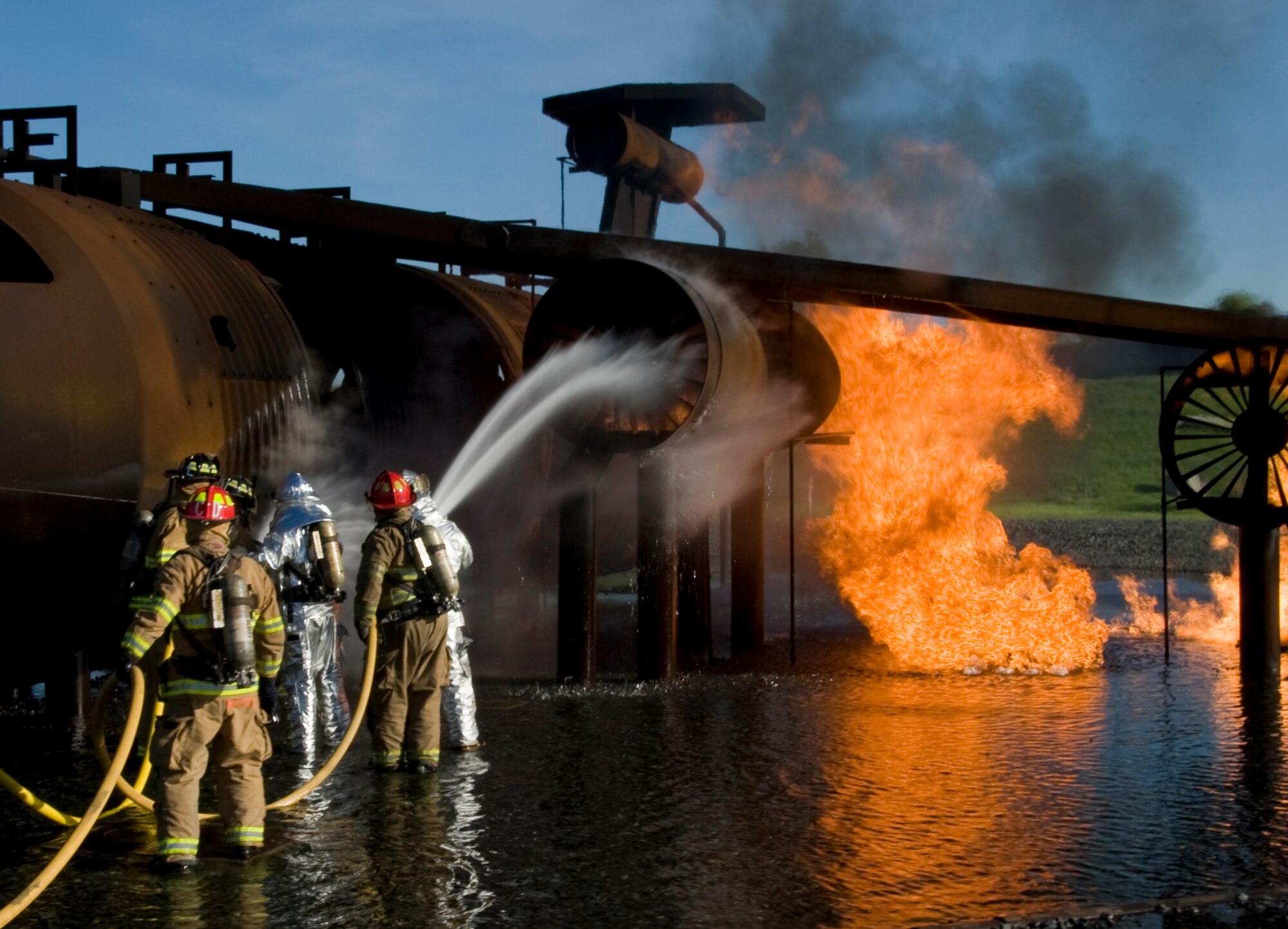 Firefighters from the Shreveport Fire Department douse a mock B-52H Stratofortress with water on Barksdale Air Force Base, La., March 22. The mock B-52 is used by Barksdale Airmen and outside agencies for training. (U.S. Air Force photo/Airman 1st Class Benjamin Gonsier)(RELEASED)
