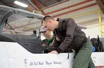 Maj. Dean Hoekstra, 39th Flying Training Squadron T-6 pilot instructor trainer, shows Sarah Neal the inner workings of a T-6 during Pilot for a Day March 9 at Joint Base San Antonio-Randolph. For the complete story on Sarah's visit and the Pilot for a Day program, see page 10. (US Air Force photo by Melissa Peterson)