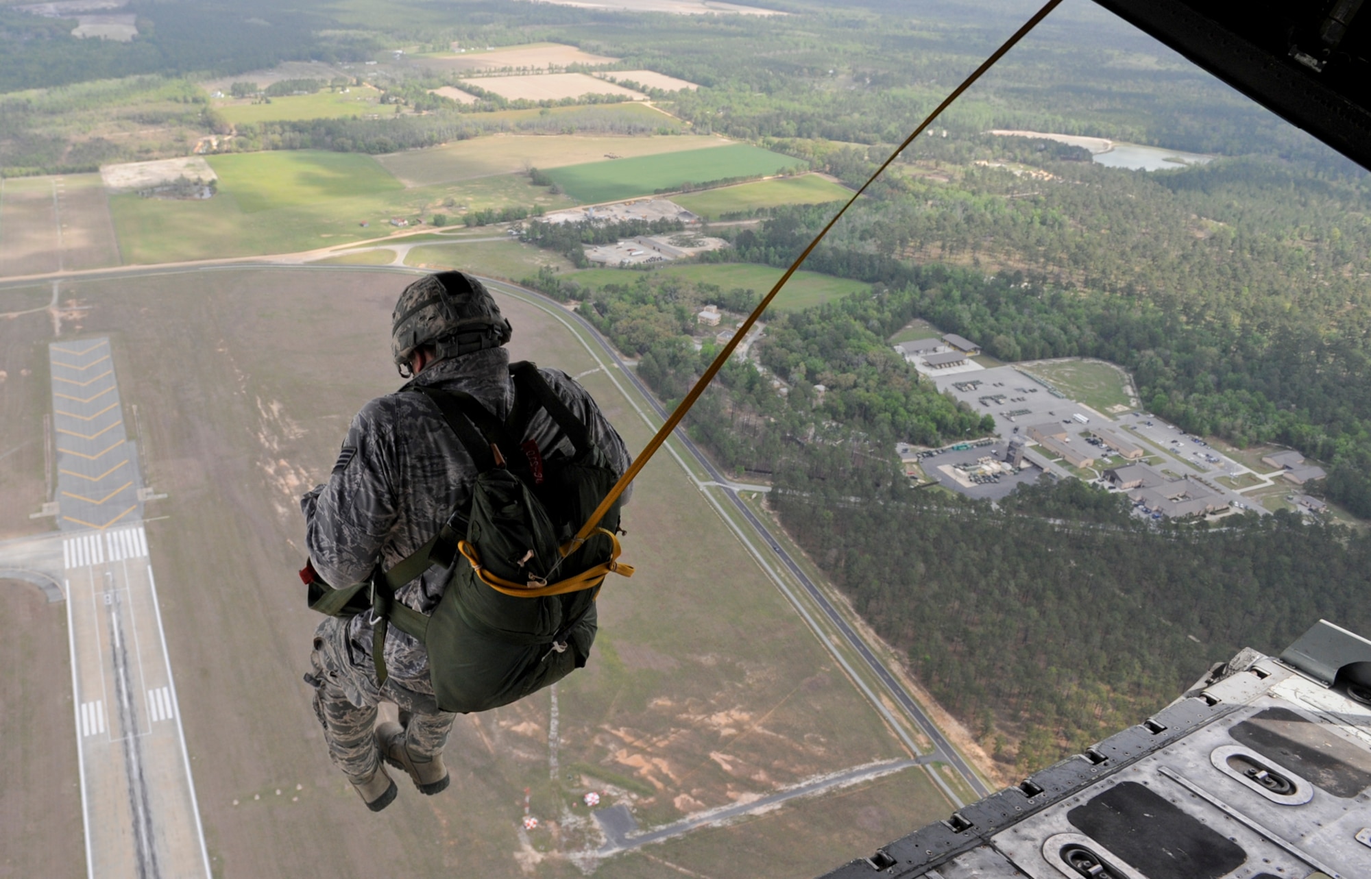 U.S. Air Force Staff Sgt. Tyler Smitka, 823d Base Defense Squadron fire team leader, jumps out of an HC-130P Combat King at Moody Air Force Base, Ga., March 21, 2012. After his jump, Smitka received the Senior Parachutist Badge for completing all of the senior rated jumpmaster requirements. (U.S. Air Force photo by Airman 1st Class Douglas Ellis/Released)
