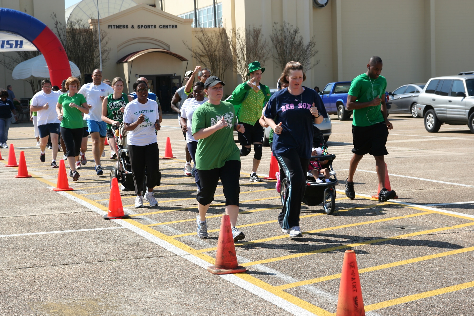 Runners show their Irish pride by wearing green during the 5-kilometer St. Patrick’s Day/Women’s History Month Run March 15 at the Maxwell fitness center. For information about fitness opportunities, visit 42fss.us. (Air Force photo/Kelly Deichert)