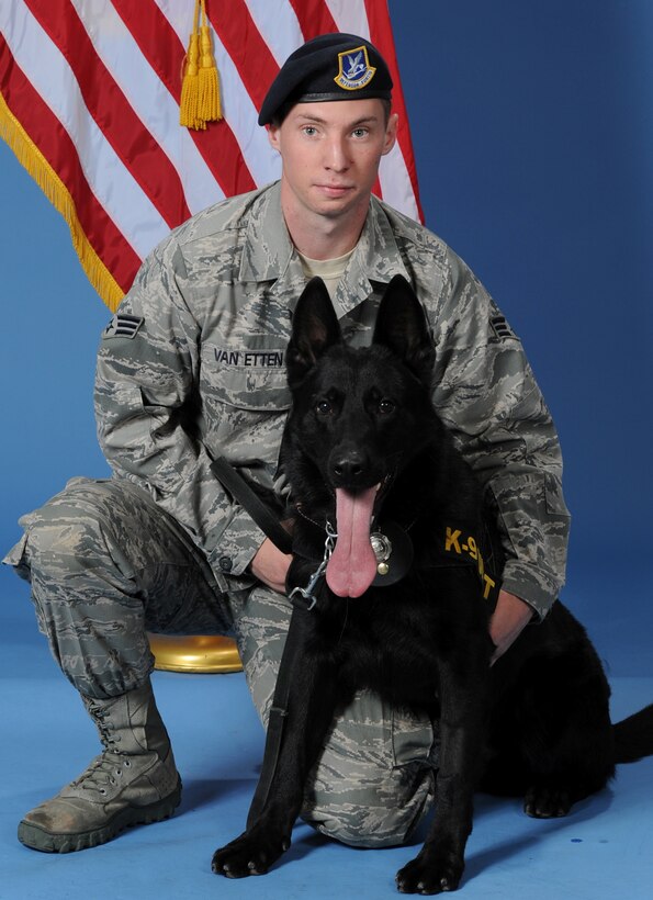 Senior Airman Jonathan Van Etten, a military working dog handler with the 82nd Security Forces Squadron at Sheppard AFB, Texas, with his canine partner, MWD Larry in this undated photo.  Van Etten and MWD Larry responded off-base to a Wichita Falls residence to conduct a sweep for explosive devices, resulting in the first explosives find by a USAF MWD detection team in over two years. (U.S. Air Force photo/Danny Webb)